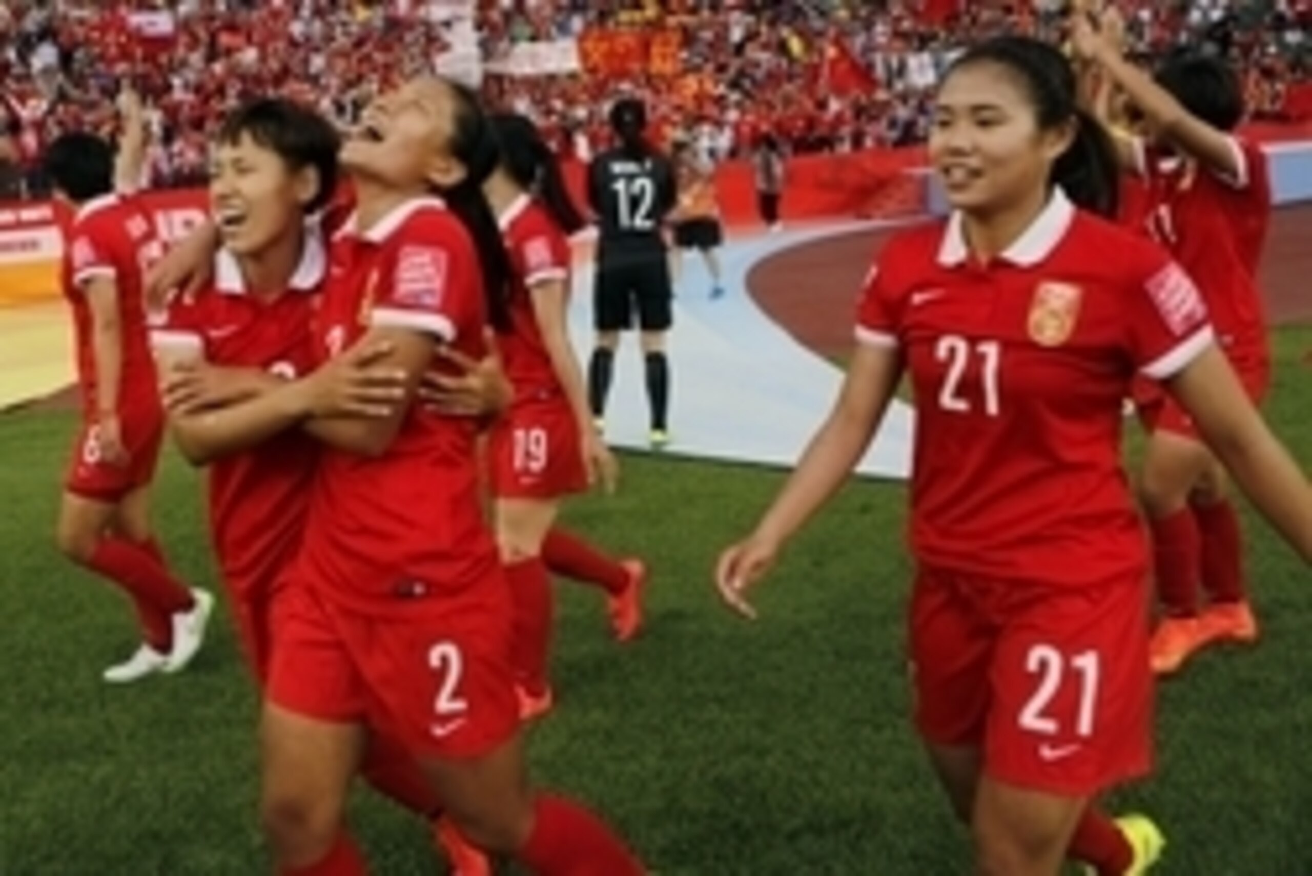 June 11, 2015; Edmonton, Alberta, CAN; China PR midfielder Wang Lisi (21), midfielder Tang Jiali (13) and defender Liu Shanshan (2) celebrate the 1-0 victory against Netherlands following a Group A soccer match in the 2015 FIFA women's World Cup at Common