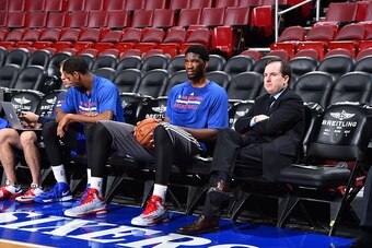 PHILADELPHIA, PA - DECEMBER 15:  Joel Embiid #21 and Sam Hinkie, General Manager of the Philadelphia 76ers before the game against the Boston Celtics on December 15, 2014 at Wells Fargo Center in Philadelphia, PA. NOTE TO USER: User expressly acknowledges