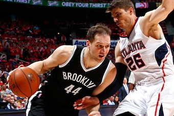 ATLANTA, GA - APRIL 29:  Bojan Bogdanovic #44 of the Brooklyn Nets drives against Kyle Korver #26 of the Atlanta Hawks during Game Five of the Eastern Conference Quarterfinals of the NBA Playoffs at Philips Arena on April 29, 2015 in Atlanta, Georgia.  NO