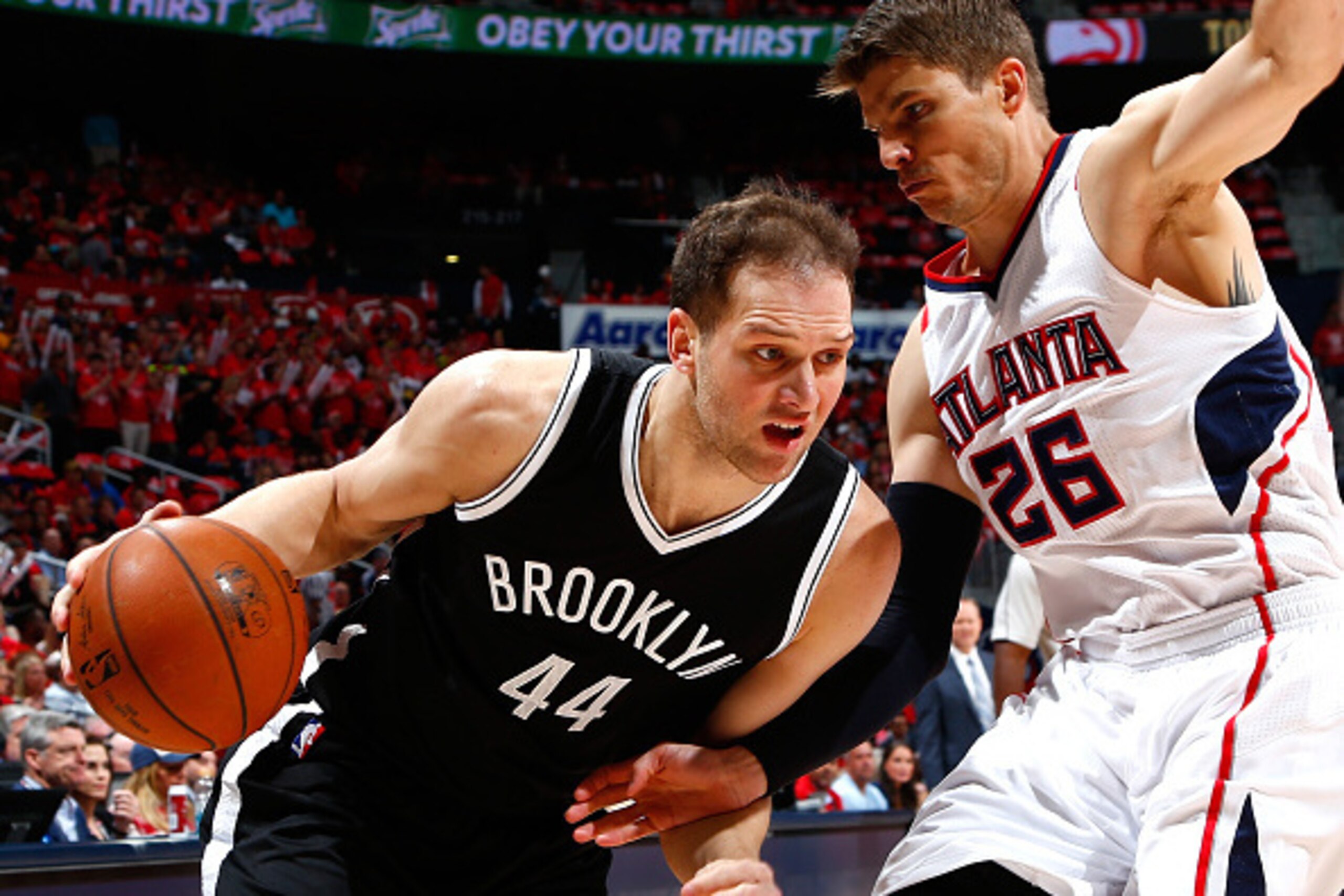 ATLANTA, GA - APRIL 29: Bojan Bogdanovic #44 of the Brooklyn Nets drives against Kyle Korver #26 of the Atlanta Hawks during Game Five of the Eastern Conference Quarterfinals of the NBA Playoffs at Philips Arena on April 29, 2015 in Atlanta, Georgia. NO ATLANTA, GA - APRIL 29: Bojan Bogdanovic #44 of the Brooklyn Nets drives against Kyle Korver #26 of the Atlanta Hawks during Game Five of the Eastern Conference Quarterfinals of the NBA Playoffs at Philips Arena on April 29, 2015 in Atlanta, Georgia. NO