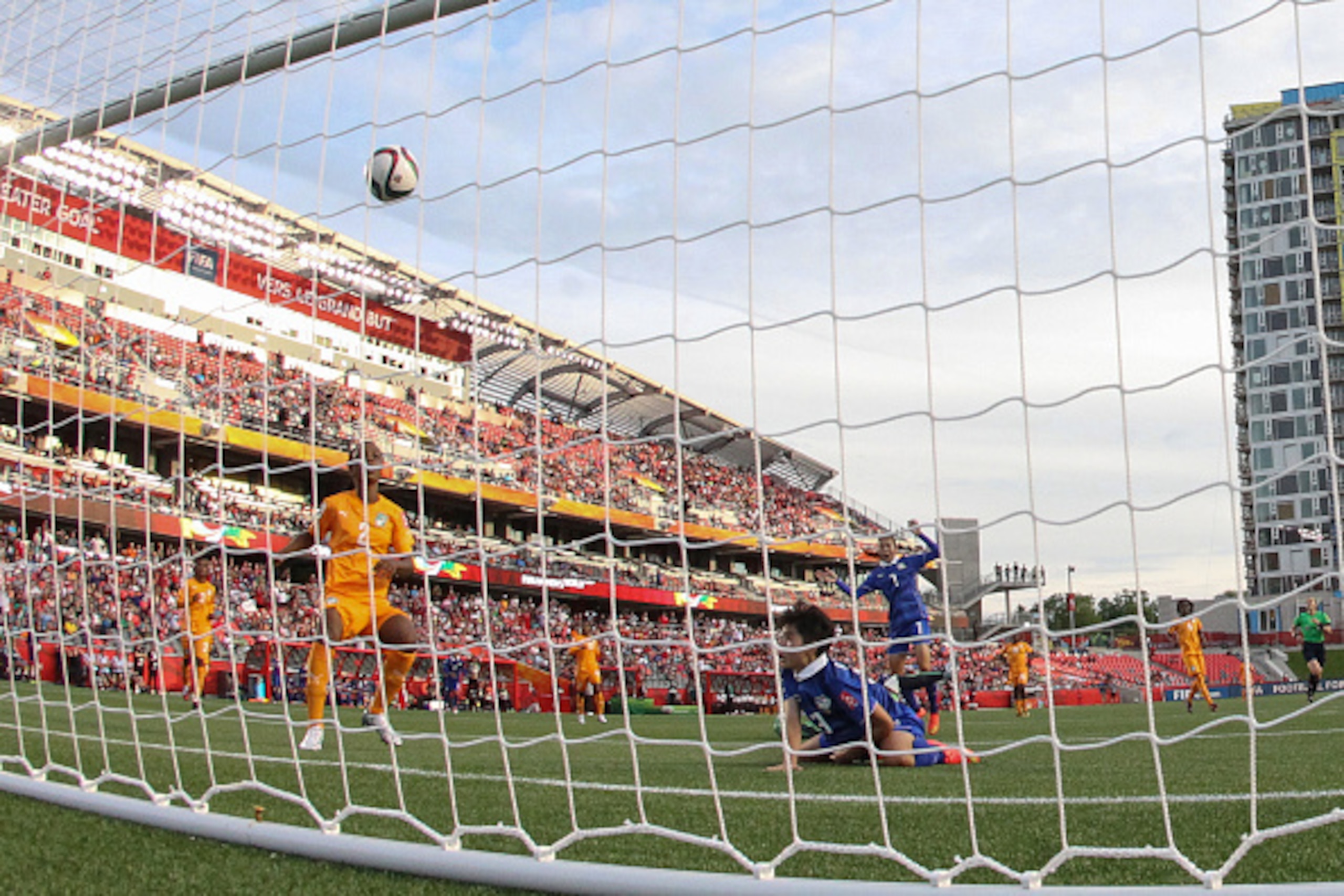 OTTAWA, ON - JUNE 11: Orathai Srimanee #13 of Thailand watches the ball cross the goal line as she scores her second goal of the game against Cote d'Ivoire during the FIFA Women's World Cup Canada 2015 Group B match between Cote d'Ivoire and Thailand at L