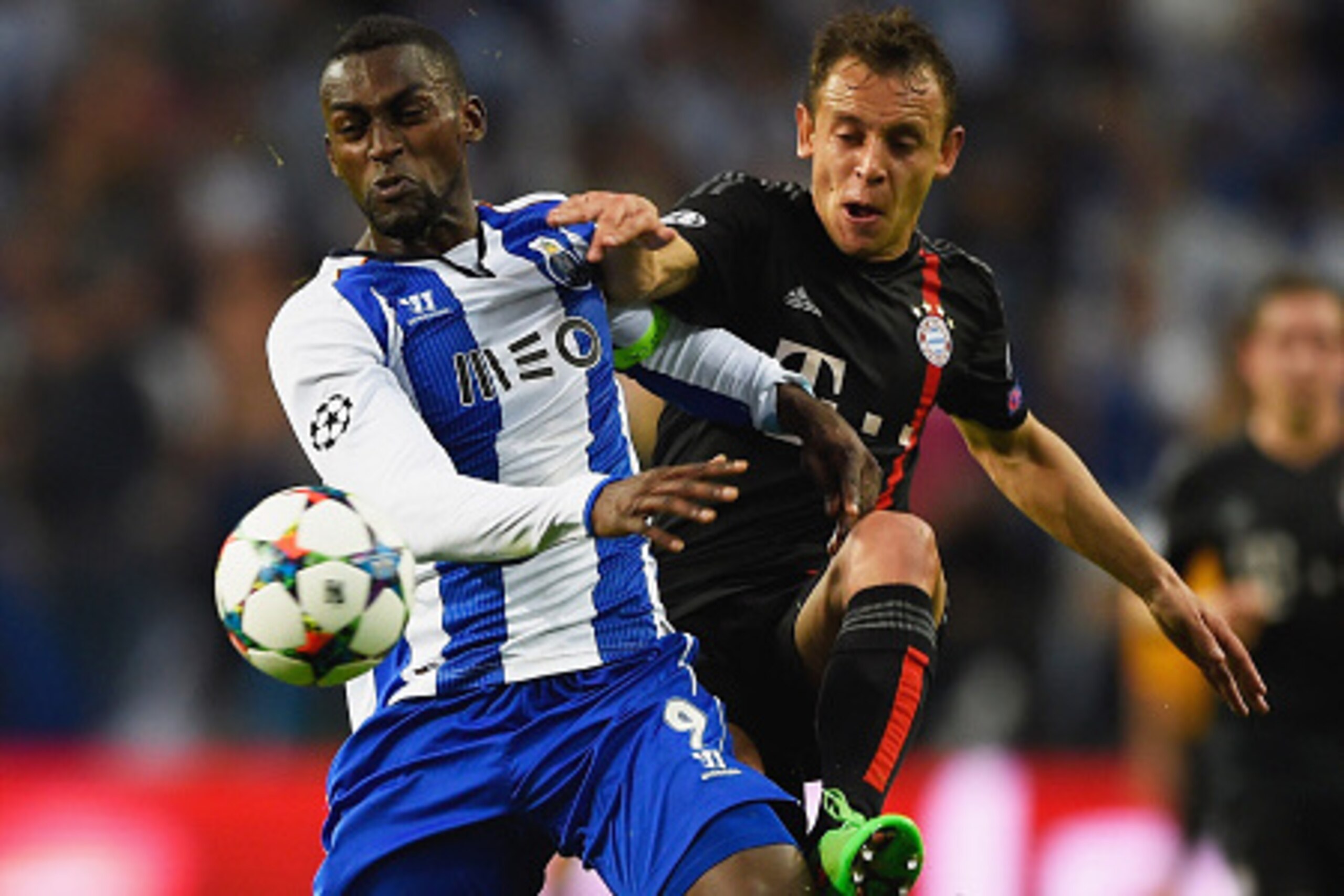 PORTO, PORTUGAL - APRIL 15:  Jackson Martinez of FC Porto holds off Rafinha of Bayern Muenchen during the UEFA Champions League Quarter Final first leg match between FC Porto and FC Bayern Muenchen at Estadio do Dragao on April 15, 2015 in Porto, Portugal