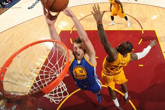 CLEVELAND, OH - JUNE 11: David Lee #10 of the Golden State Warriors dunks against LeBron James #23 of the Cleveland Cavaliers during Game Four of the 2015 NBA Finals at The Quicken Loans Arena on June 11, 2015 in Cleveland, Ohio. NOTE TO USER: User expres