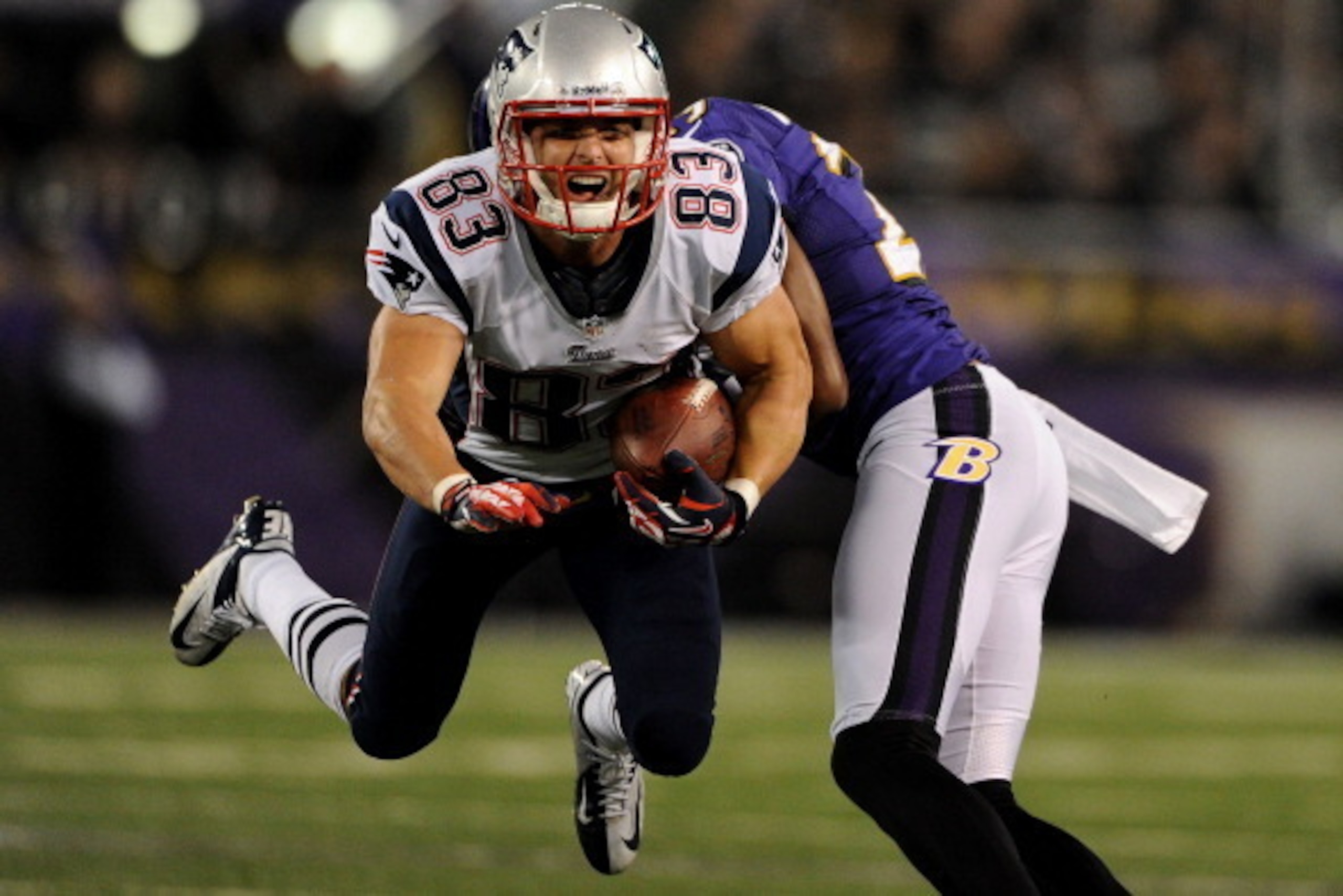 BALTIMORE, MD - SEPTEMBER 23: Wide receiver Wes Welker #83 of the New England Patriots is hit in the third quarter against the Baltimore Ravens at M&T Bank Stadium on September 23, 2012 in Baltimore, Maryland. The Baltimore Ravens won, 31-30. (Photo by Pa