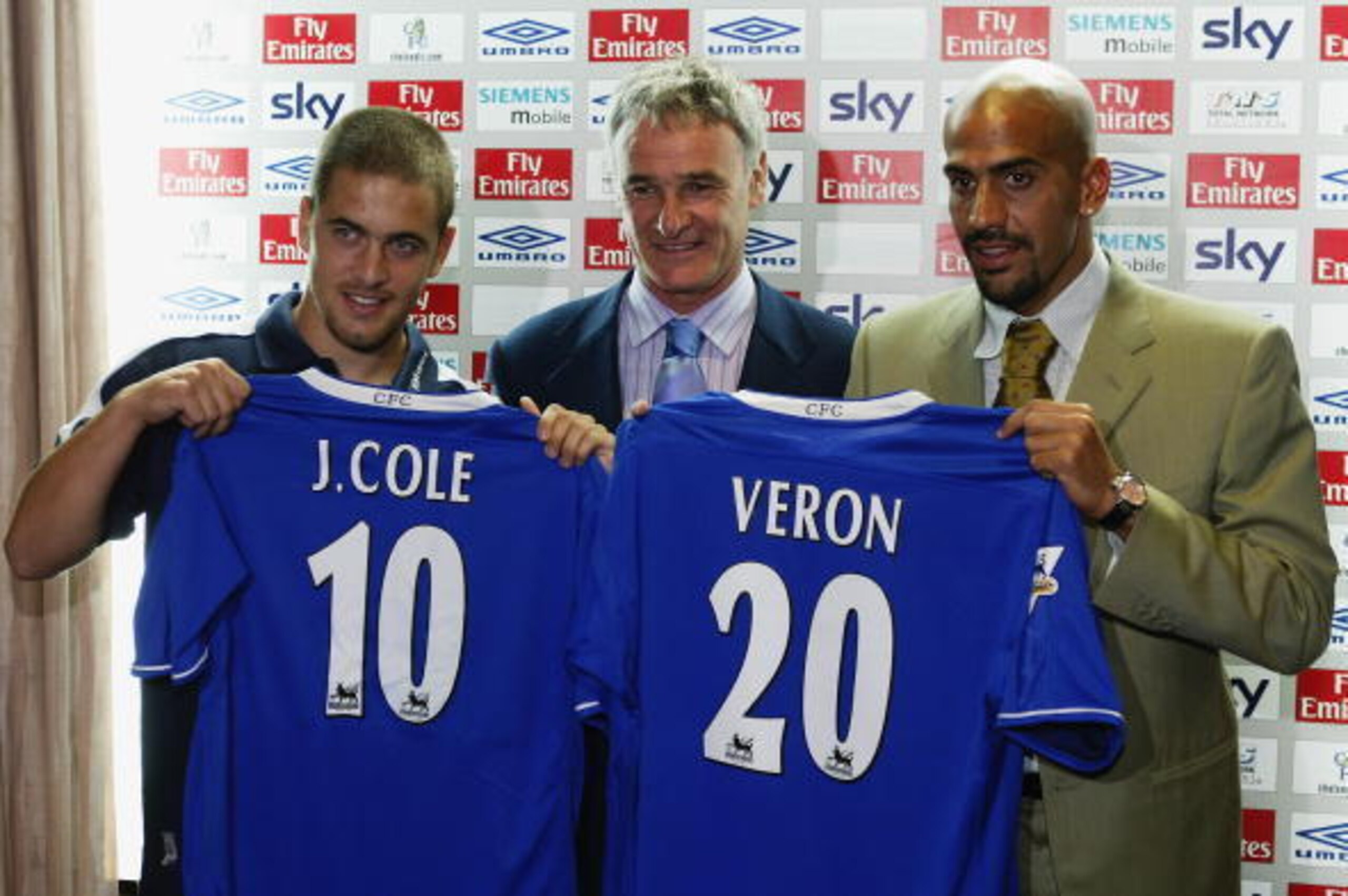 LONDON - AUGUST 7:  Chelsea manager shows off new signings Joe Cole and Juan Sebastian Veron during a press conference on August 7, 2003 at Stamford Bridge, London. (Photo by Clive Rose/Getty Images).