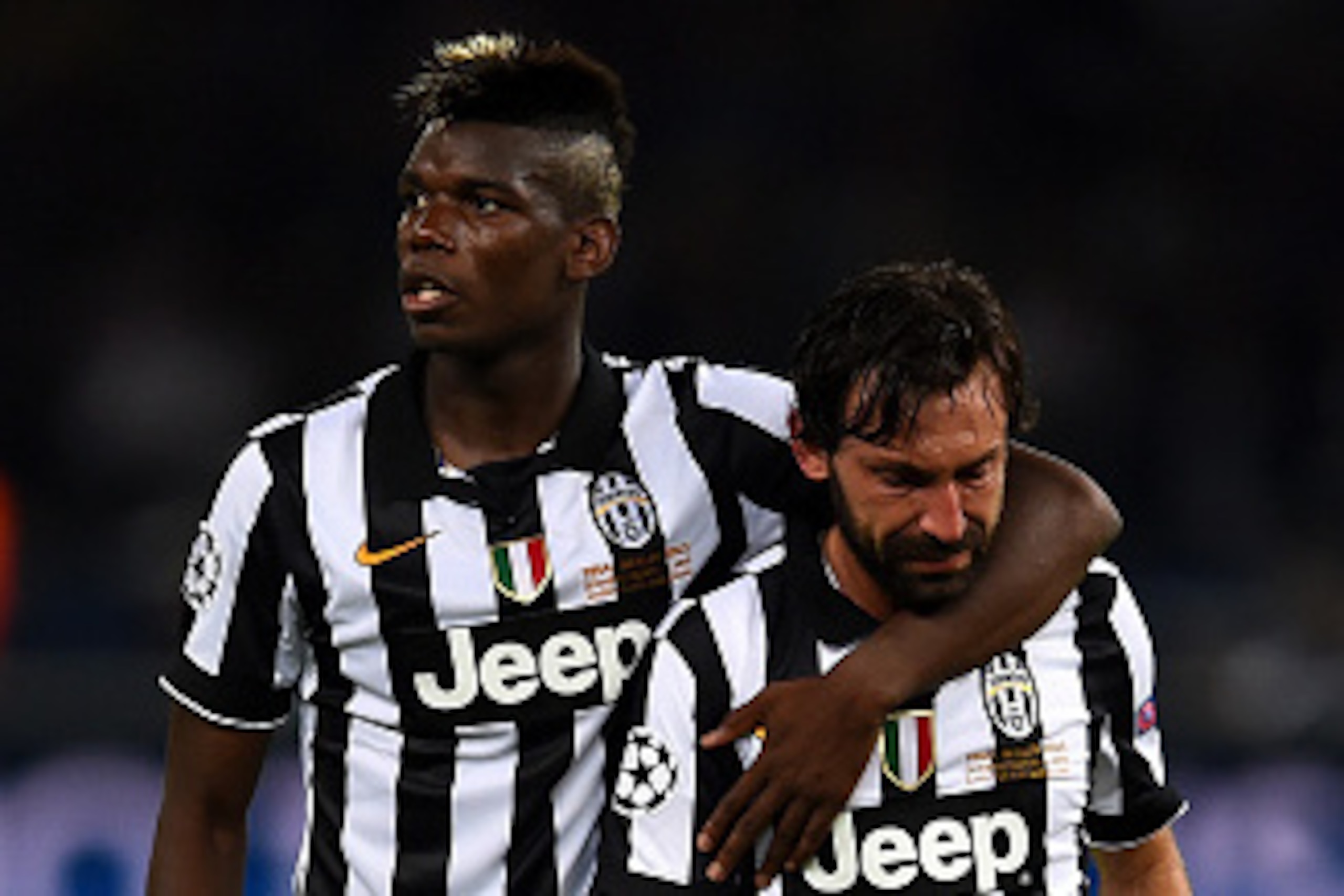 BERLIN, GERMANY - JUNE 06:  Andrea Pirlo of Juventus is consoled by Paul Pogba after the UEFA Champions League Final between Juventus and FC Barcelona at Olympiastadion on June 6, 2015 in Berlin, Germany.  (Photo by Laurence Griffiths/Getty Images)