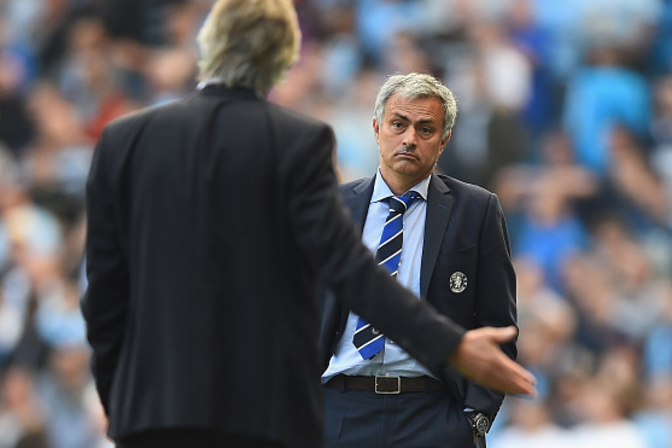 MANCHESTER, ENGLAND - SEPTEMBER 21: Jose Mourinho of Chelsea speaks with Manuel Pellegrini of Manchester City during the Barclays Premier League match between Manchester City and Chelsea at Etihad Stadium on September 21, 2014 in Manchester, England.  (Ph