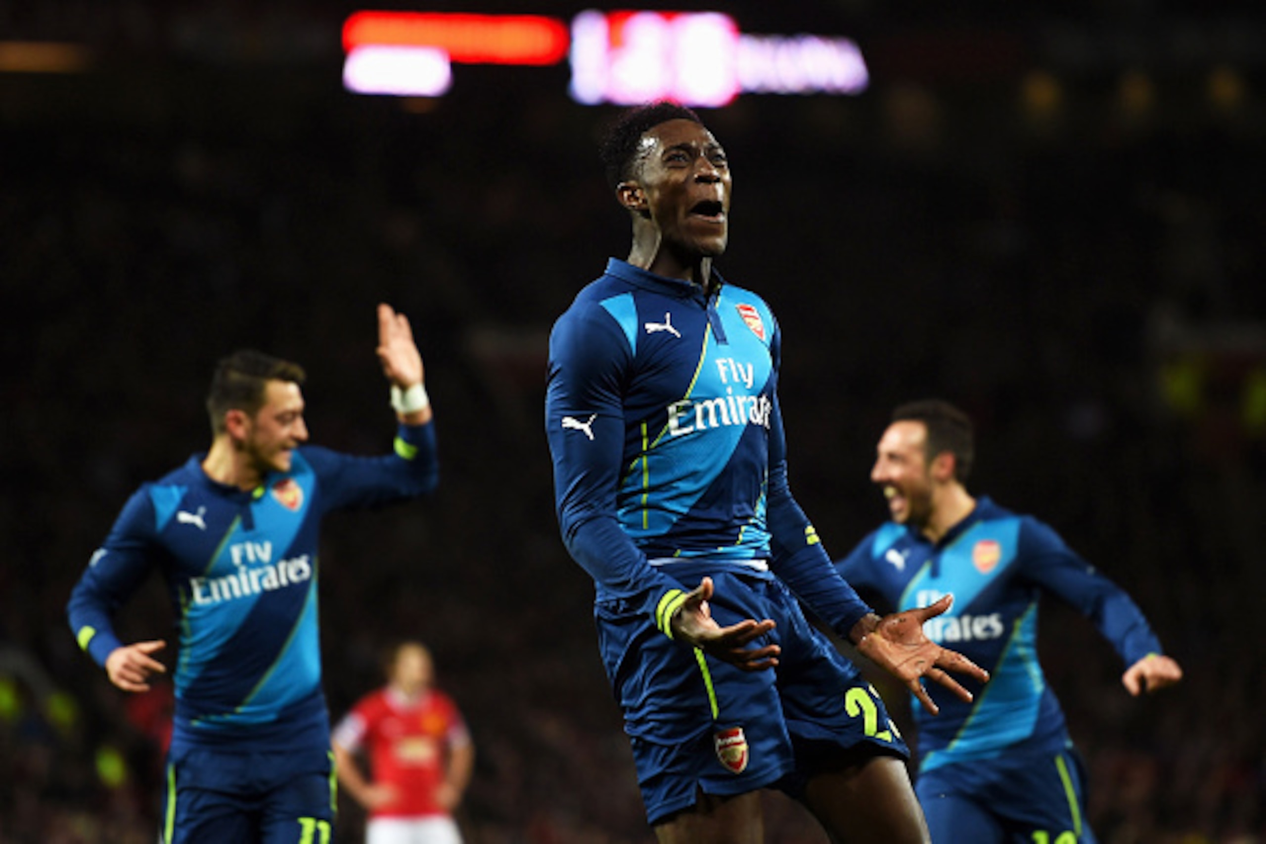 MANCHESTER, ENGLAND - MARCH 09:  Danny Welbeck of Arsenal celebrates after scoring his team's second goal during the FA Cup Quarter Final match between Manchester United and Arsenal at Old Trafford on March 9, 2015 in Manchester, England.  (Photo by Laure