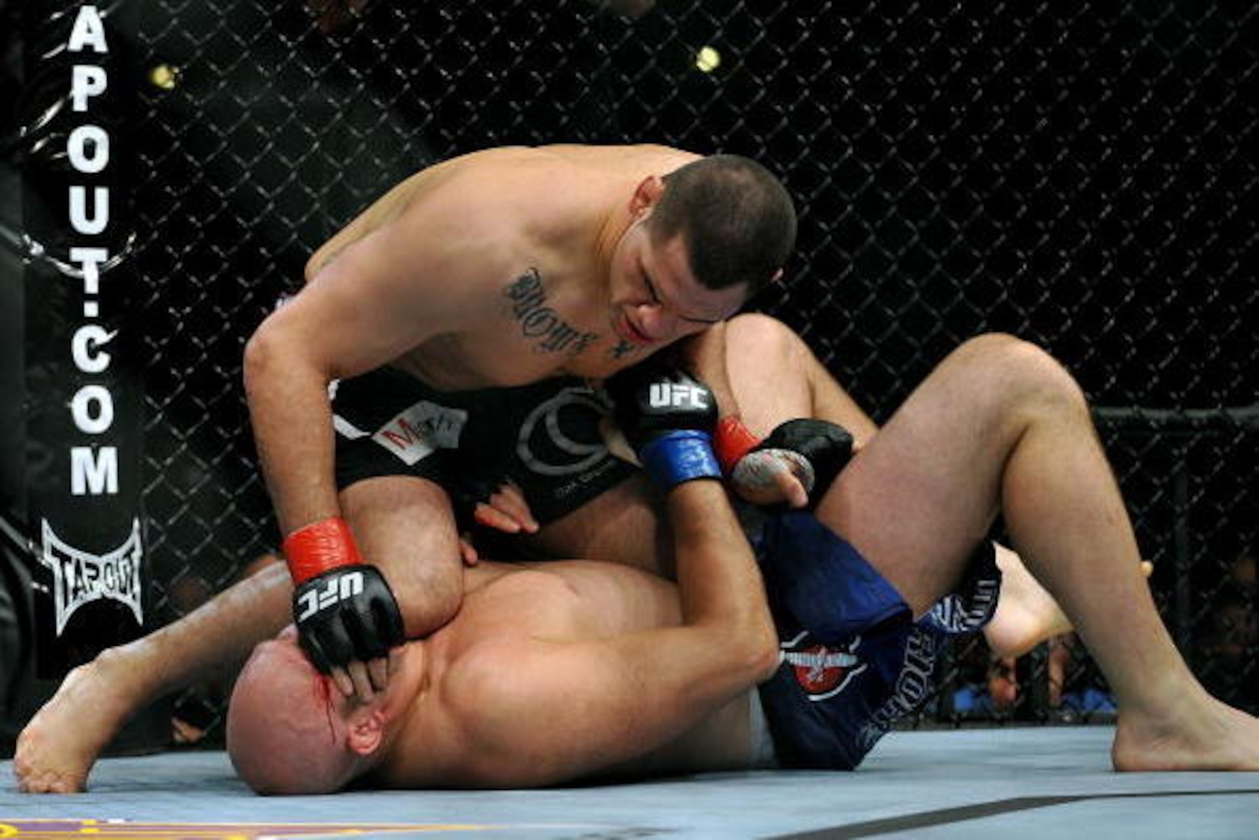 LOS ANGELES, CA - OCTOBER 24:  UFC fighter Cain Velasquez (top) battles with UFC fighter Ben Rothwell (bottom) during their Heavyweight bout at UFC 104: Machida vs. Shogun at Staples Center on October 24, 2009 in Los Angeles, California.  (Photo by Jon Ko