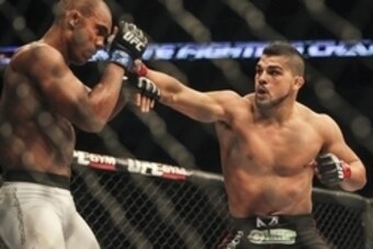Jun 28, 2014; San Antonio, TX, USA; Kelvin Gastelum (red gloves) fights Nico Musoke (blue gloves) in a Welterweight bout at UFC Fight Night 43 at AT&T Center. Mandatory Credit: Troy Taormina-USA TODAY Sports