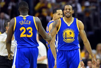 Jun 11, 2015; Cleveland, OH, USA; Golden State Warriors guard Andre Iguodala (9) celebrates with forward Draymond Green (23) during the third quarter against the Cleveland Cavaliers in game four of the NBA Finals at Quicken Loans Arena. Mandatory Credit: