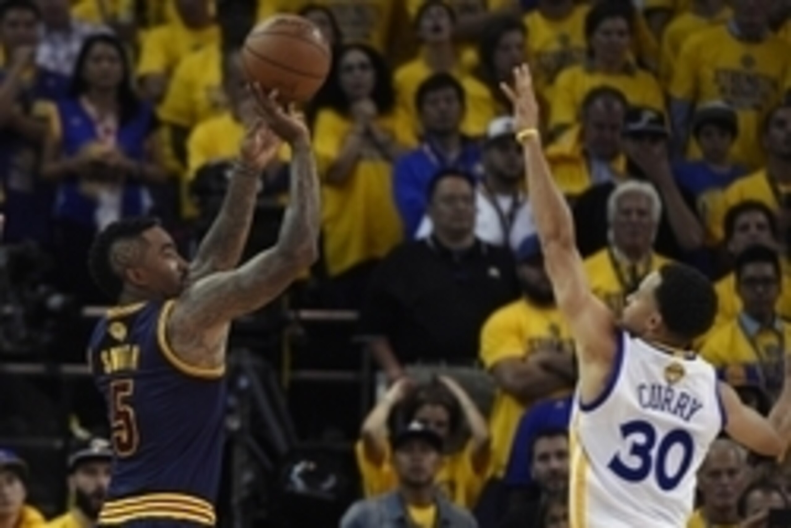 June 4, 2015; Oakland, CA, USA; Cleveland Cavaliers guard J.R. Smith (5) shoots against the defense of Golden State Warriors guard Stephen Curry (30) during the overtime period in game one of the NBA Finals. at Oracle Arena. Mandatory Credit: Kyle Terada-