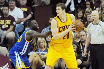 CLEVELAND, OH - JUNE 11:  Timofey Mozgov #20 of the Cleveland Cavaliers handles the ball against the Golden State Warriors in Game Four of the 2015 NBA Finals at The Quicken Loans Arena on June 11, 2015 in Cleveland, Ohio. NOTE TO USER: User expressly ack
