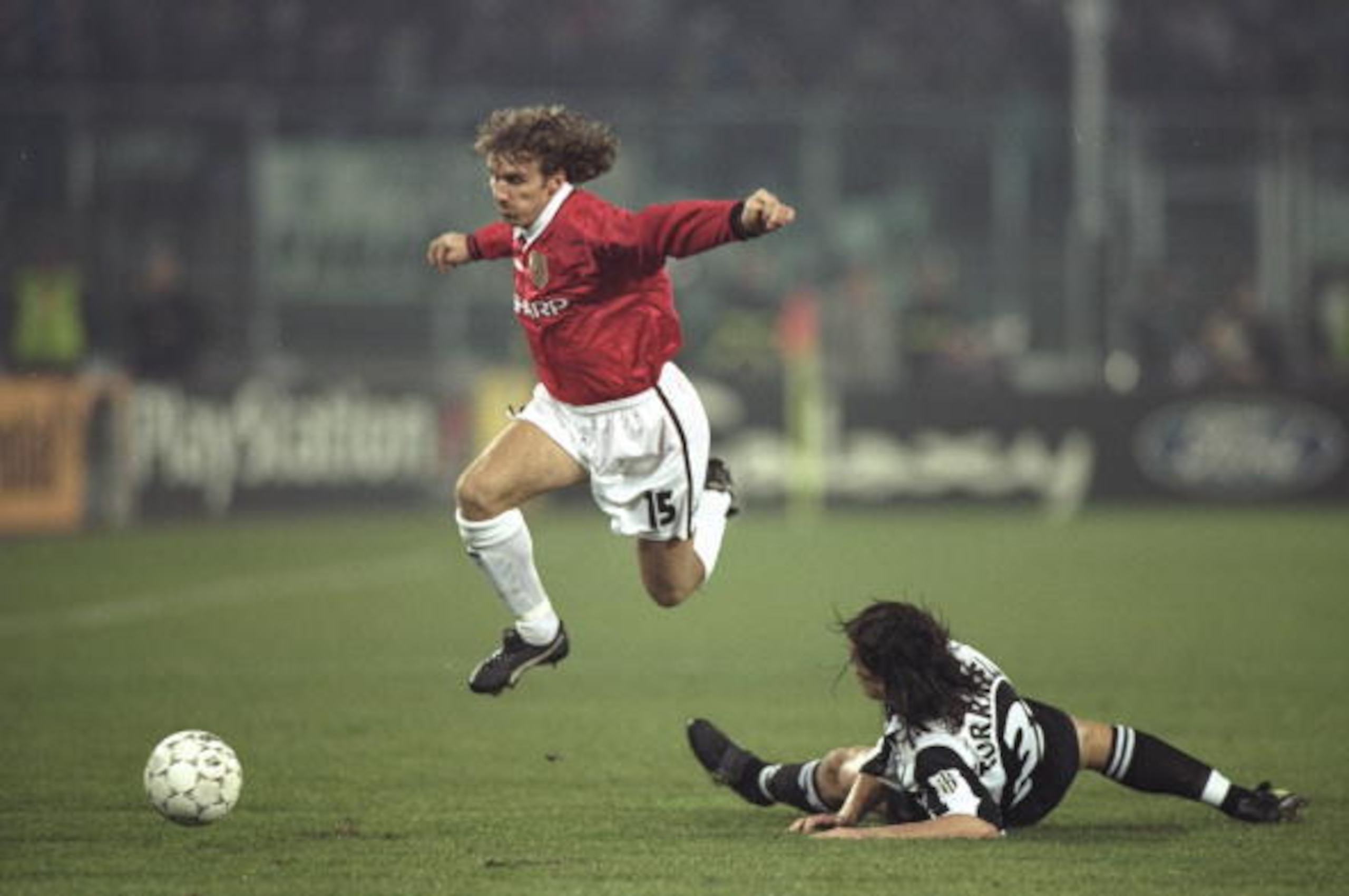 10 Dec 1997:  Karel Poborsky of Manchester United skips over the challenge of Moreno Torricelli of Juventus during the UEFA Champions League match at the Stadio Delle Alpi in Turin, Italy. Juventus won 1-0 to qualify for the quarter-finals. \ Mandatory Cr