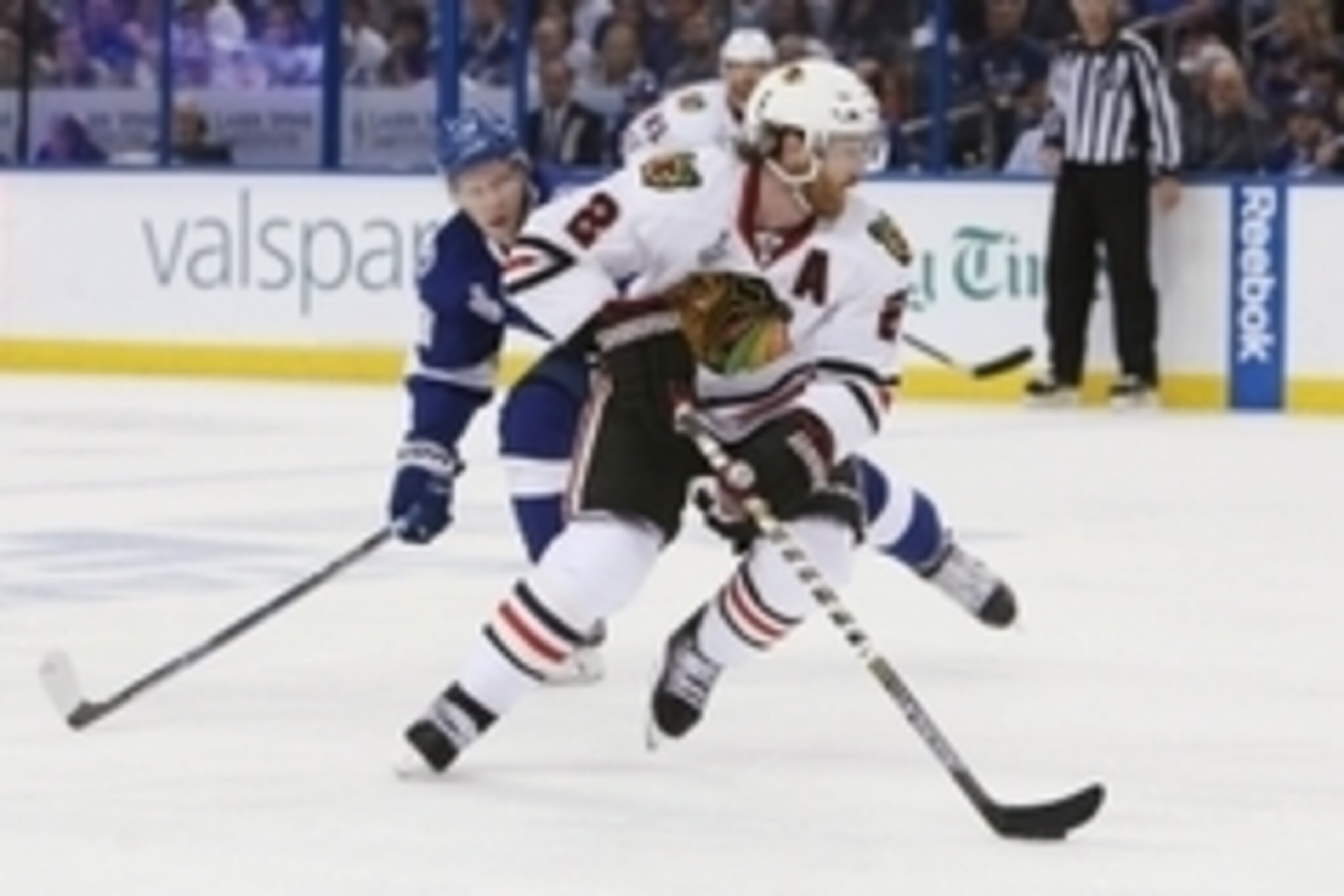 Jun 3, 2015; Tampa, FL, USA; Chicago Blackhawks defenseman Duncan Keith (2) controls the puck against Tampa Bay Lightning left wing Ondrej Palat (18) in the second period in game one of the 2015 Stanley Cup Final at Amalie Arena. Mandatory Credit: Kim Kle