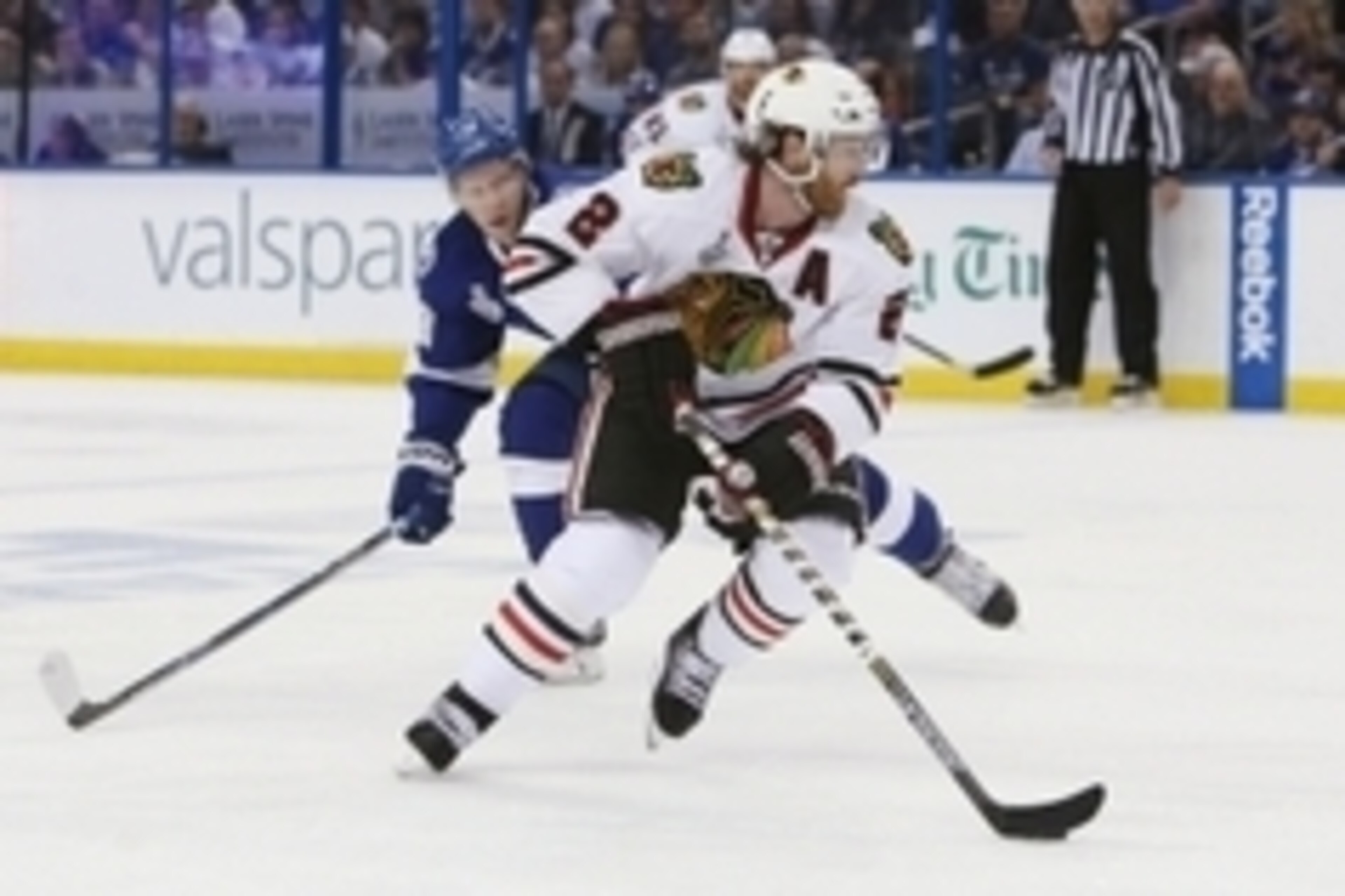 Jun 3, 2015; Tampa, FL, USA; Chicago Blackhawks defenseman Duncan Keith (2) controls the puck against Tampa Bay Lightning left wing Ondrej Palat (18) in the second period in game one of the 2015 Stanley Cup Final at Amalie Arena. Mandatory Credit: Kim Kle