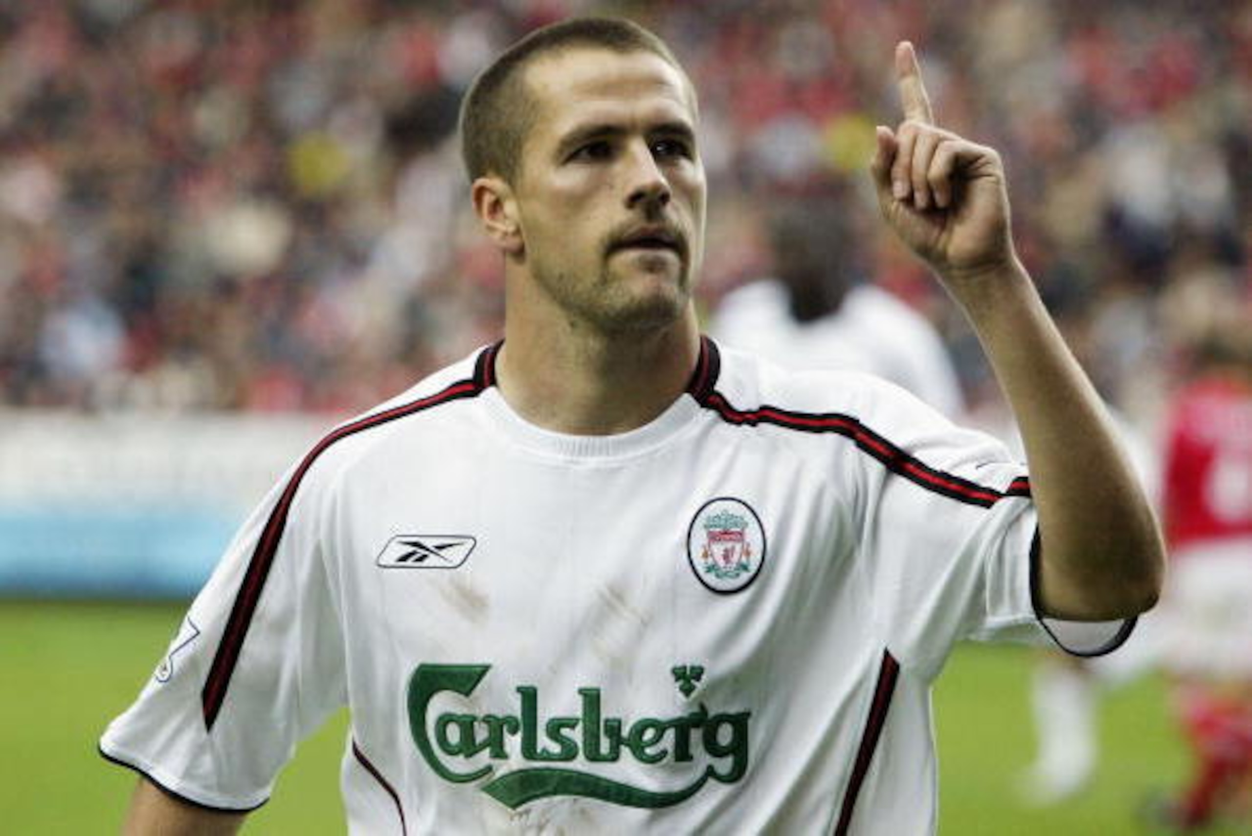 LONDON - SEPTEMBER 28:  Michael Owen of Liverpool celebrates scoring a second goal from the penalty spot during the FA Barclaycard Premiership match between Charlton Athletic and Liverpool at The Valley on September 28, 2003 in London. (Photo By Jamie McD