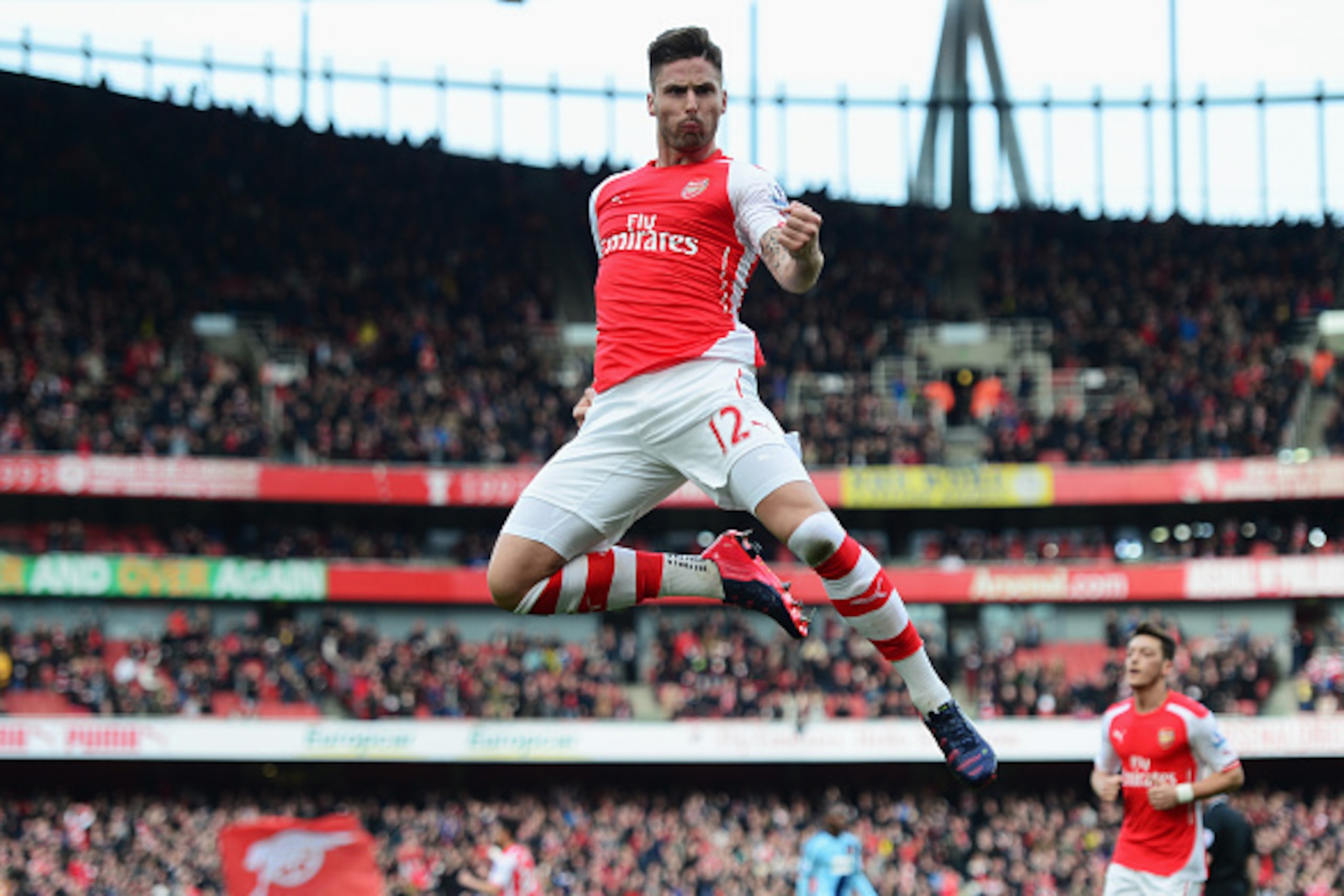 LONDON, ENGLAND - MARCH 14:  Olivier Giroud of Arsenal celebrates scoring the opening goal during the Barclays Premier League match between Arsenal and West Ham United at Emirates Stadium on March 14, 2015 in London, England.  (Photo by Jamie McDonald/Get