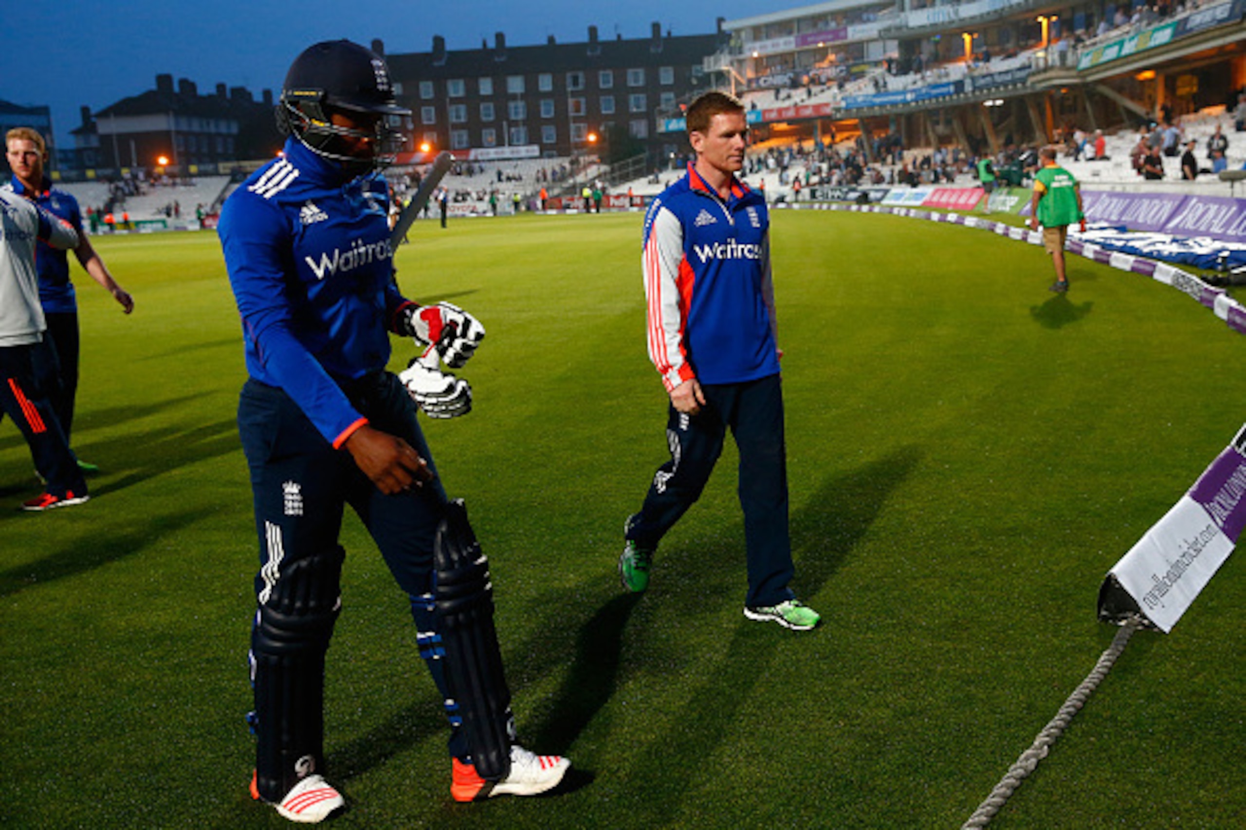 LONDON, ENGLAND - JUNE 12:  Chris Jordan of England and Eoin Morgan of England leave the pitch after their loss during the 2nd ODI Royal London One-Day Series 2015 at The Kia Oval on June 12, 2015 in London, England.  (Photo by Julian Finney/Getty Images)