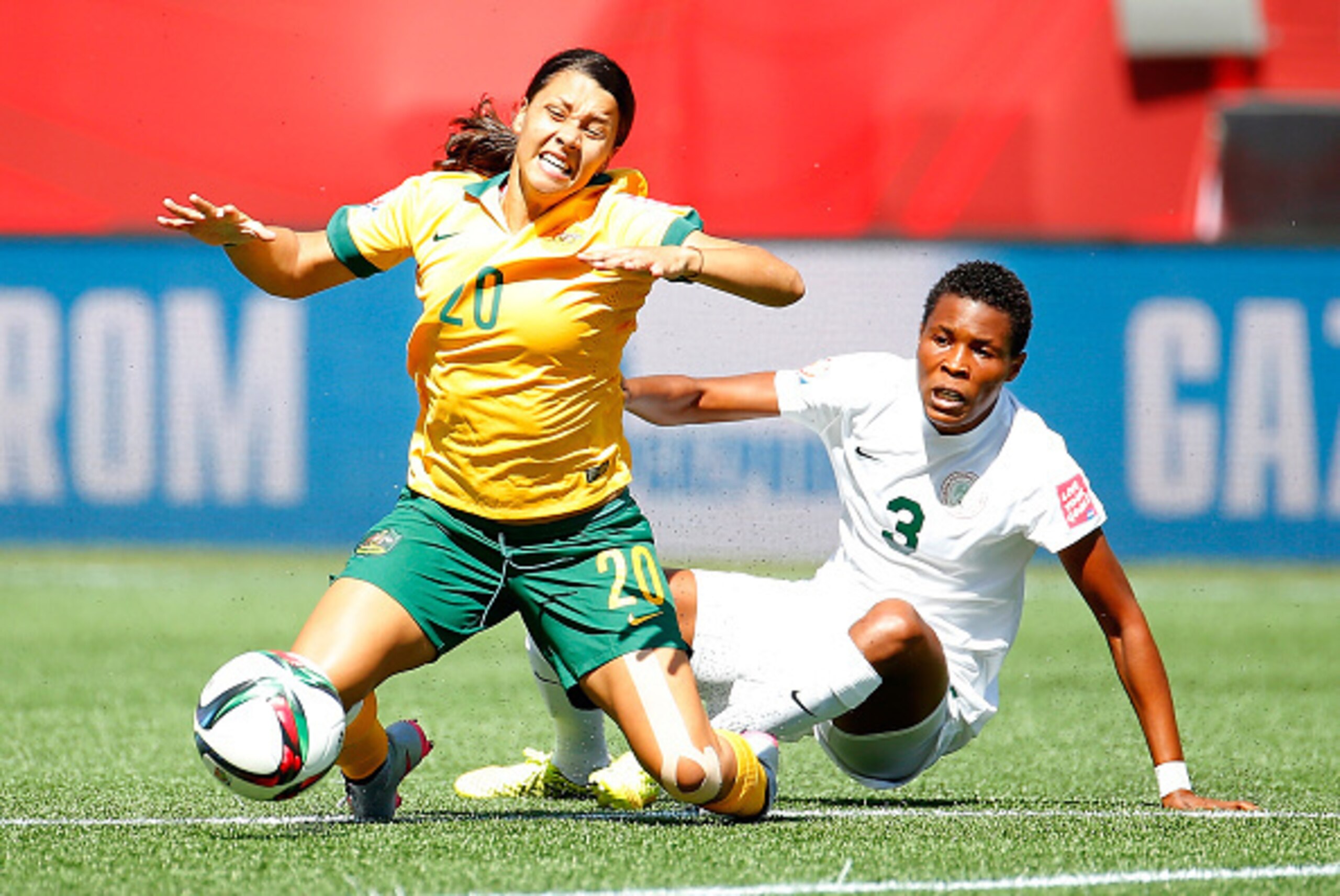 WINNIPEG, MB - JUNE 12:  Osinachi Ohale #3 of Nigeria is called for a foul as she tackles Samantha Kerr #20 of Australia during the FIFA Women's World Cup Canada 2015 match between Australia and Nigeria at Winnipeg Stadium on June 12, 2015 in Winnipeg, Ca
