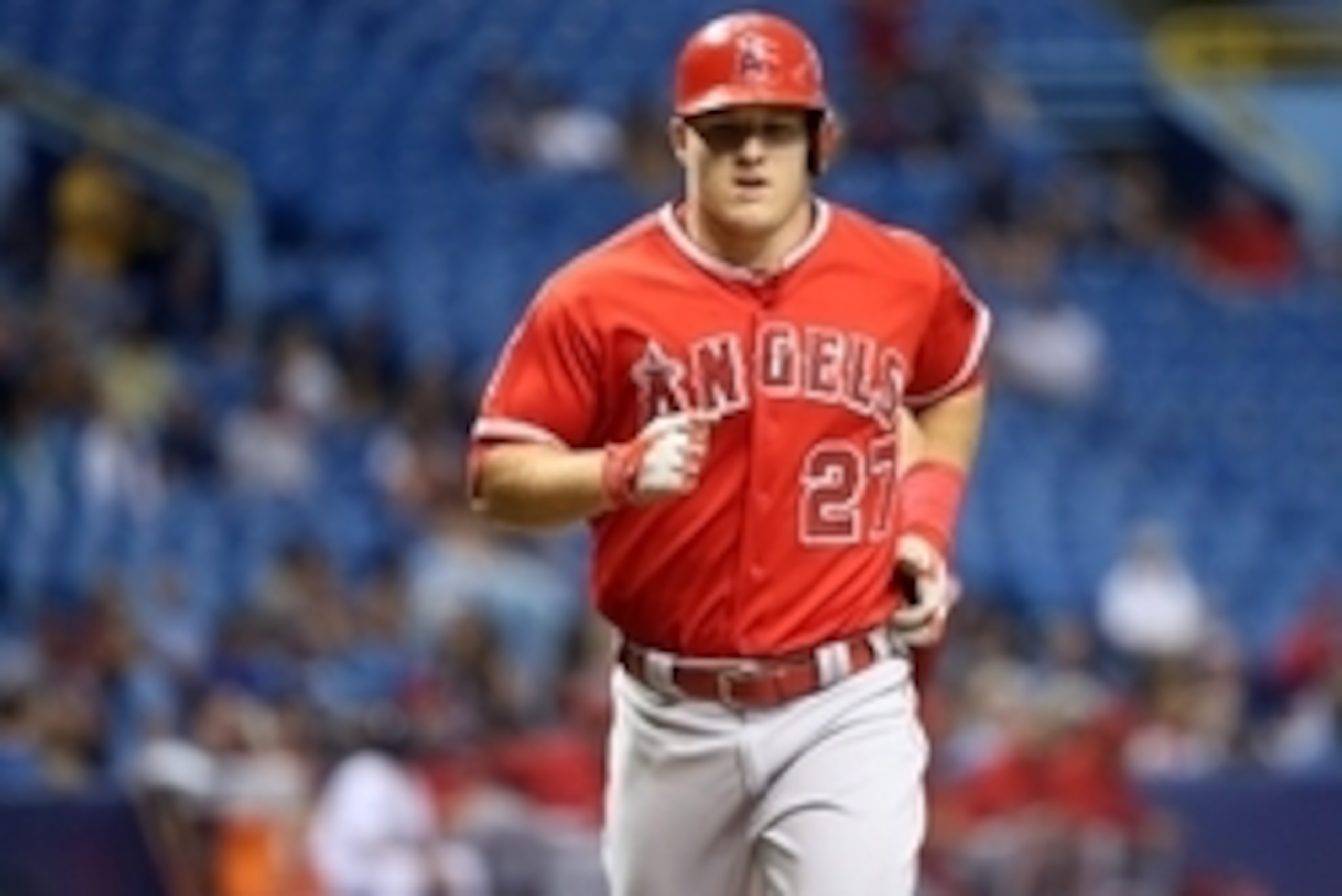 Jun 11, 2015; St. Petersburg, FL, USA; Los Angeles Angels center fielder Mike Trout (27) runs home after hitting a home run during the sixth inning against the Tampa Bay Rays at Tropicana Field. Mandatory Credit: Kim Klement-USA TODAY Sports