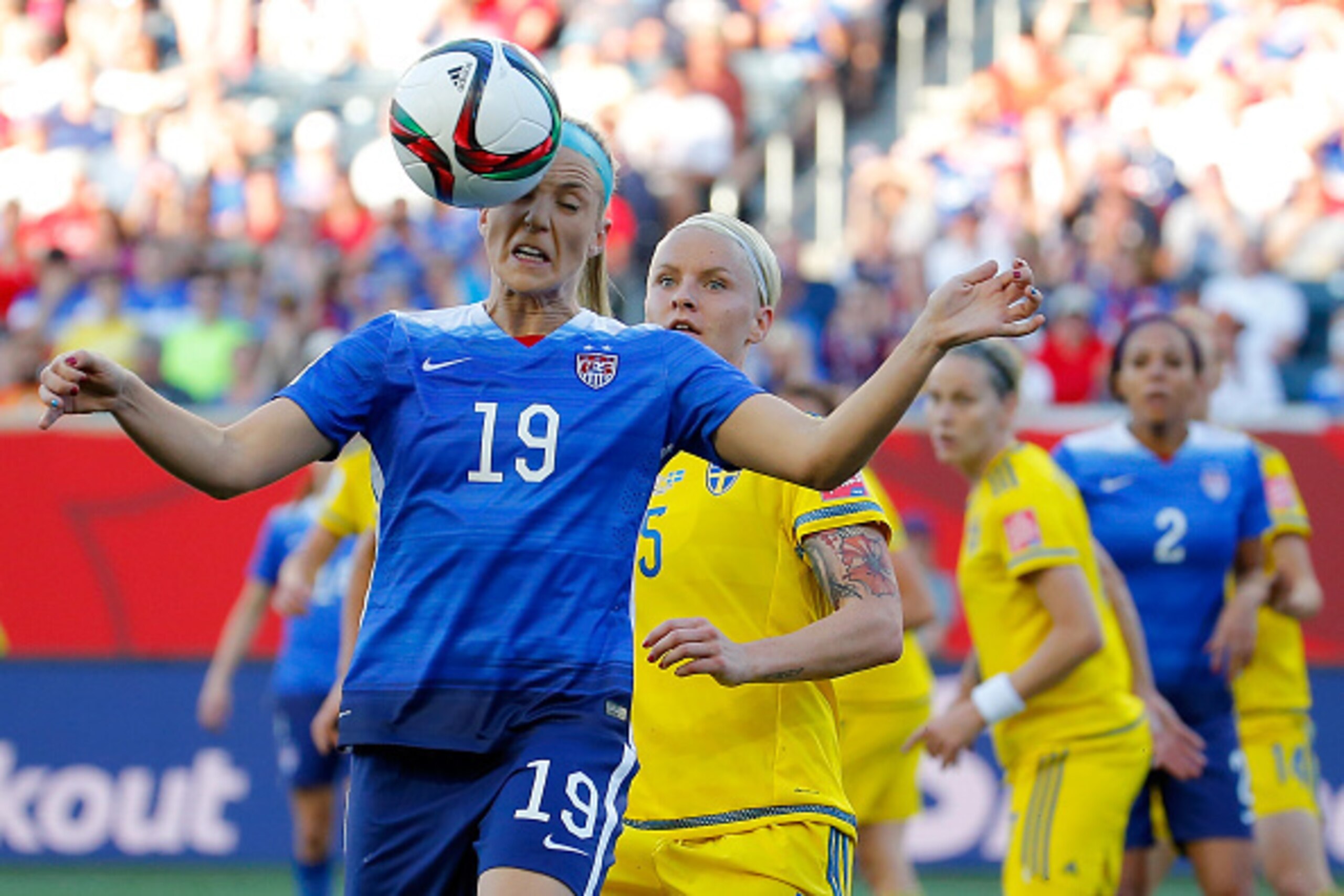 WINNIPEG, MB - JUNE 12:  Julie Johnston #19 of the United States heads the ball in front of Nilla Fischer #5 of Sweden in the FIFA Women's World Cup Canada 2015 match at Winnipeg Stadium on June 12, 2015 in Winnipeg, Canada.  (Photo by Kevin C. Cox/Getty 