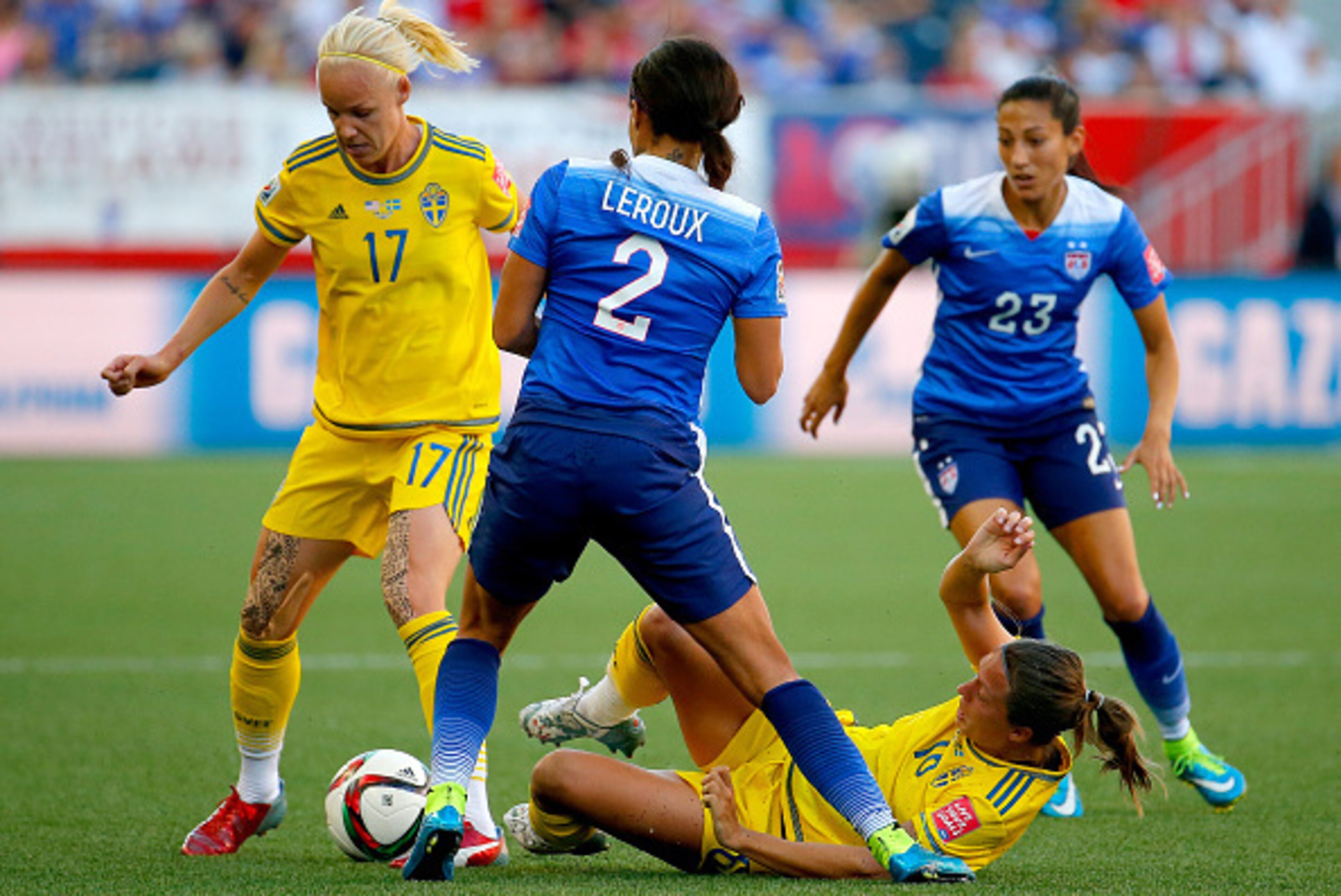 WINNIPEG, MB - JUNE 12:  Caroline Seger #17 of Sweden goes after the ball against Christen Press #23 and Sydney Leroux #2 of the United States in the first half in the FIFA Women's World Cup Canada 2015 match at Winnipeg Stadium on June 12, 2015 in Winnip
