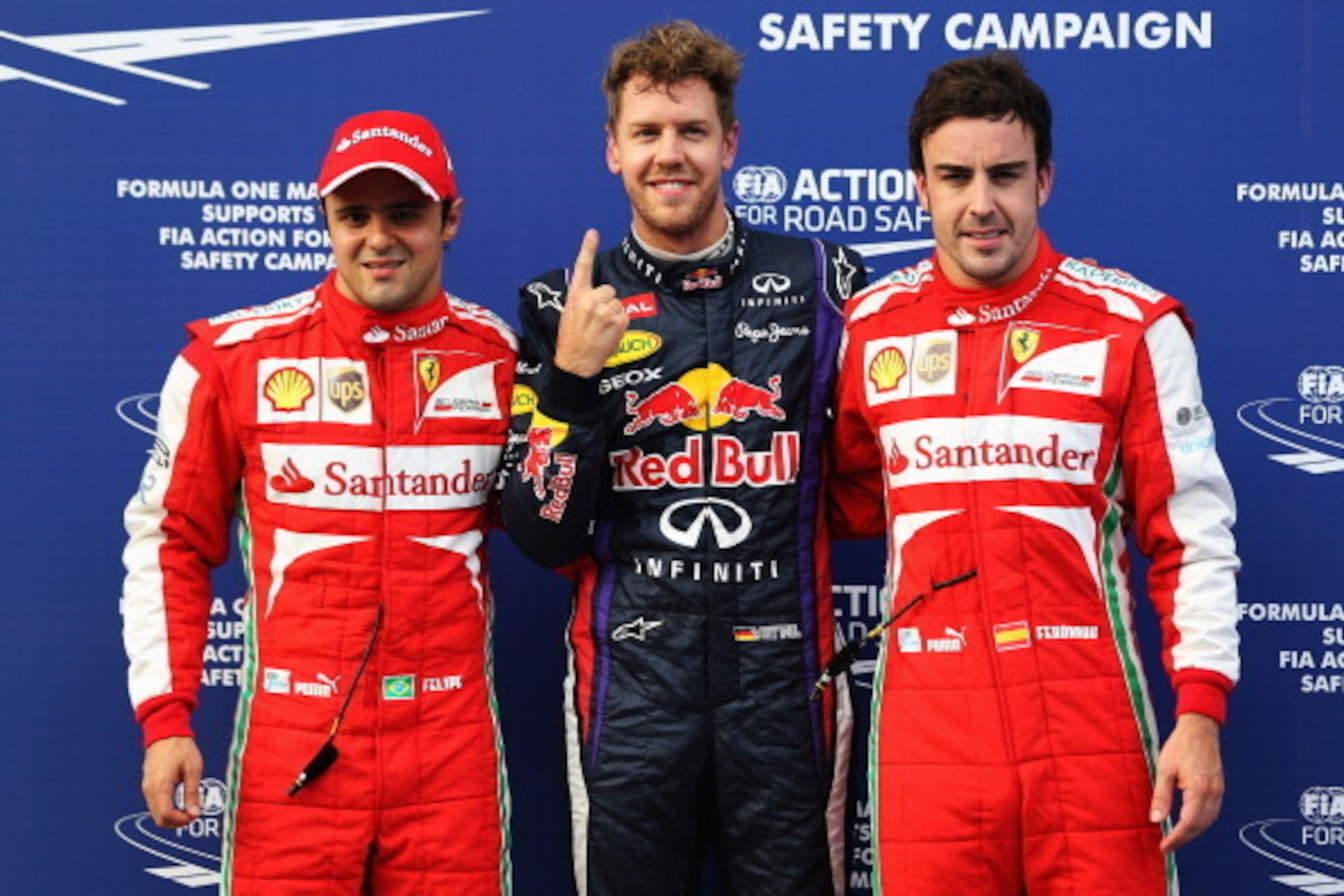 KUALA LUMPUR, MALAYSIA - MARCH 23:  Pole sitter Sebastian Vettel (C) of Germany and Infiniti Red Bull Racing celebrates with second placed Felipe Massa (L) of Brazil and Ferrari and third placed Fernando Alonso (R) of Spain and Ferrari following qualifyin