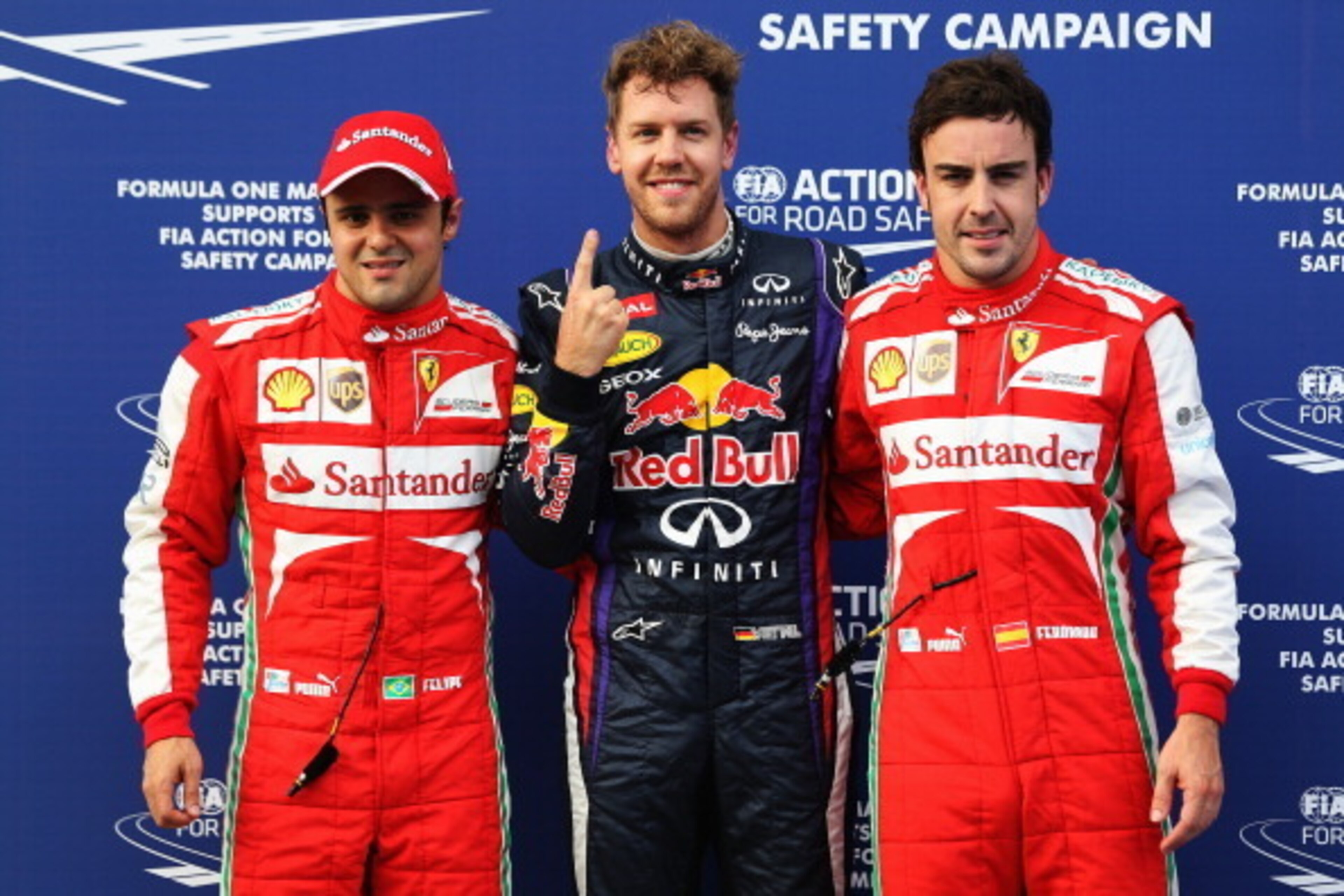 KUALA LUMPUR, MALAYSIA - MARCH 23:  Pole sitter Sebastian Vettel (C) of Germany and Infiniti Red Bull Racing celebrates with second placed Felipe Massa (L) of Brazil and Ferrari and third placed Fernando Alonso (R) of Spain and Ferrari following qualifyin