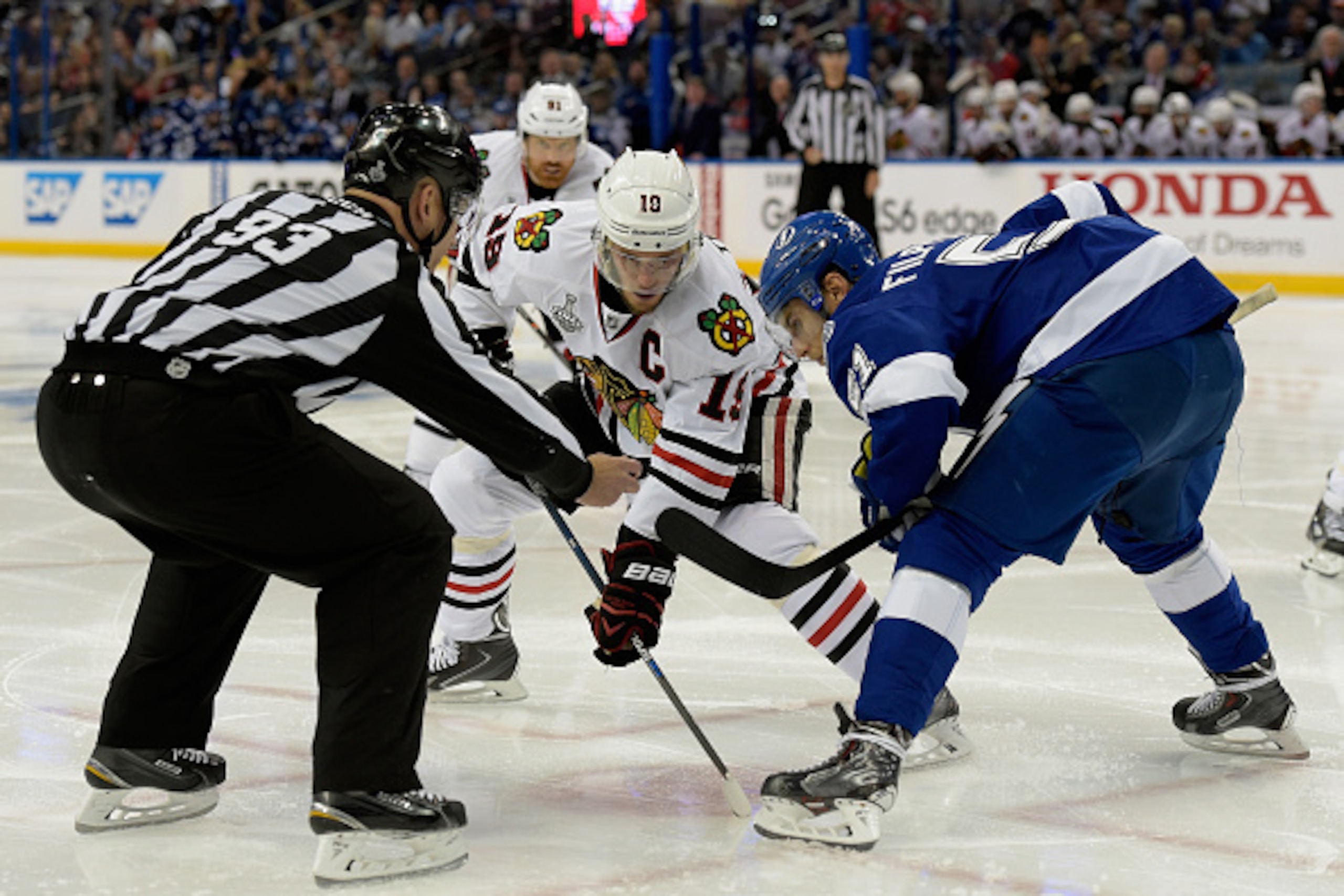 TAMPA, FL - JUNE 03:  Jonathan Toews #19 of the Chicago Blackhawks and Valtteri Filppula #51 of the Tampa Bay Lightning face off during Game One of the 2015 NHL Stanley Cup Final at Amalie Arena on June 3, 2015 in Tampa, Florida.  (Photo by Bill Smith/NHL