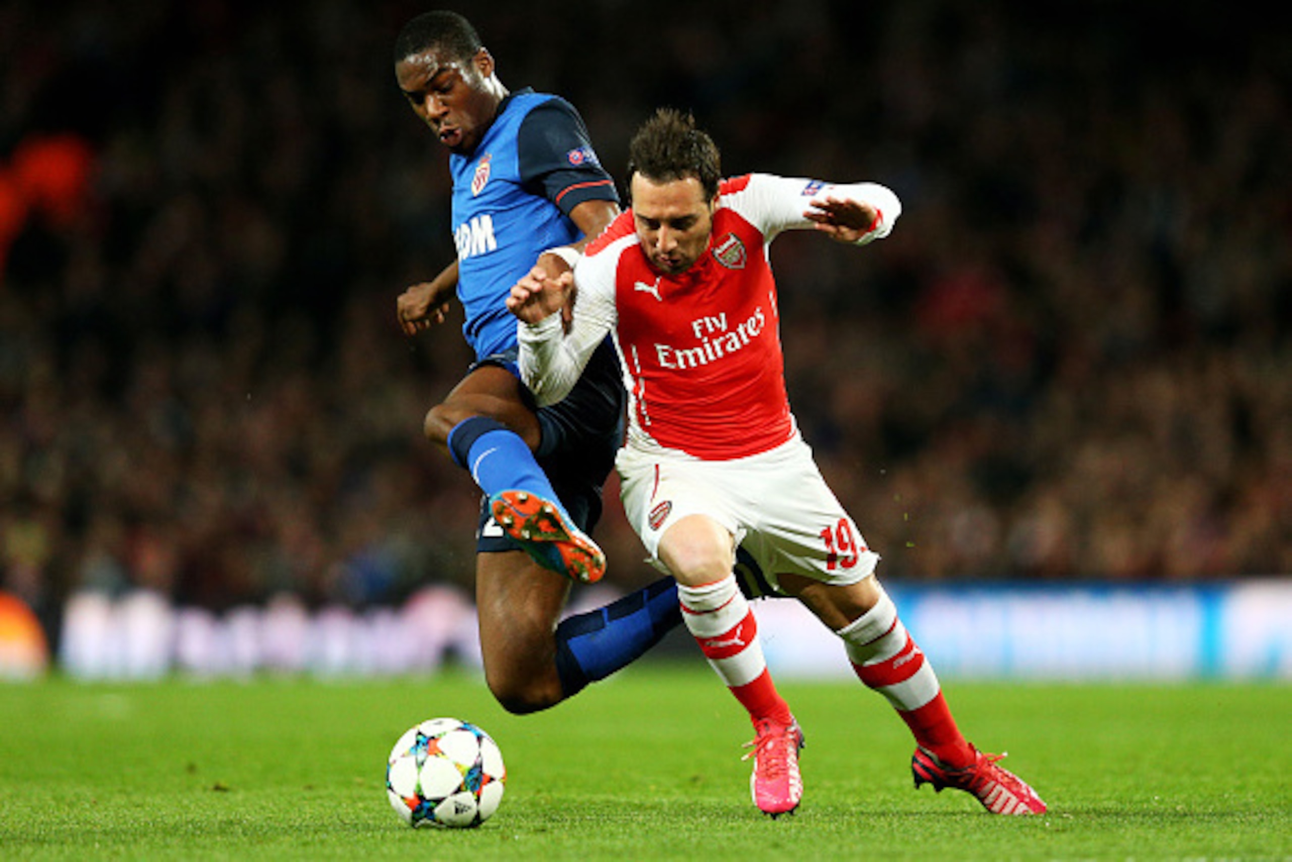 LONDON, ENGLAND - FEBRUARY 25:  Geoffrey Kondogbia of Monaco and Santi Cazorla of Arsenal battle for the ball during the UEFA Champions League round of 16, first leg match between Arsenal and Monaco at The Emirates Stadium on February 25, 2015 in London, 