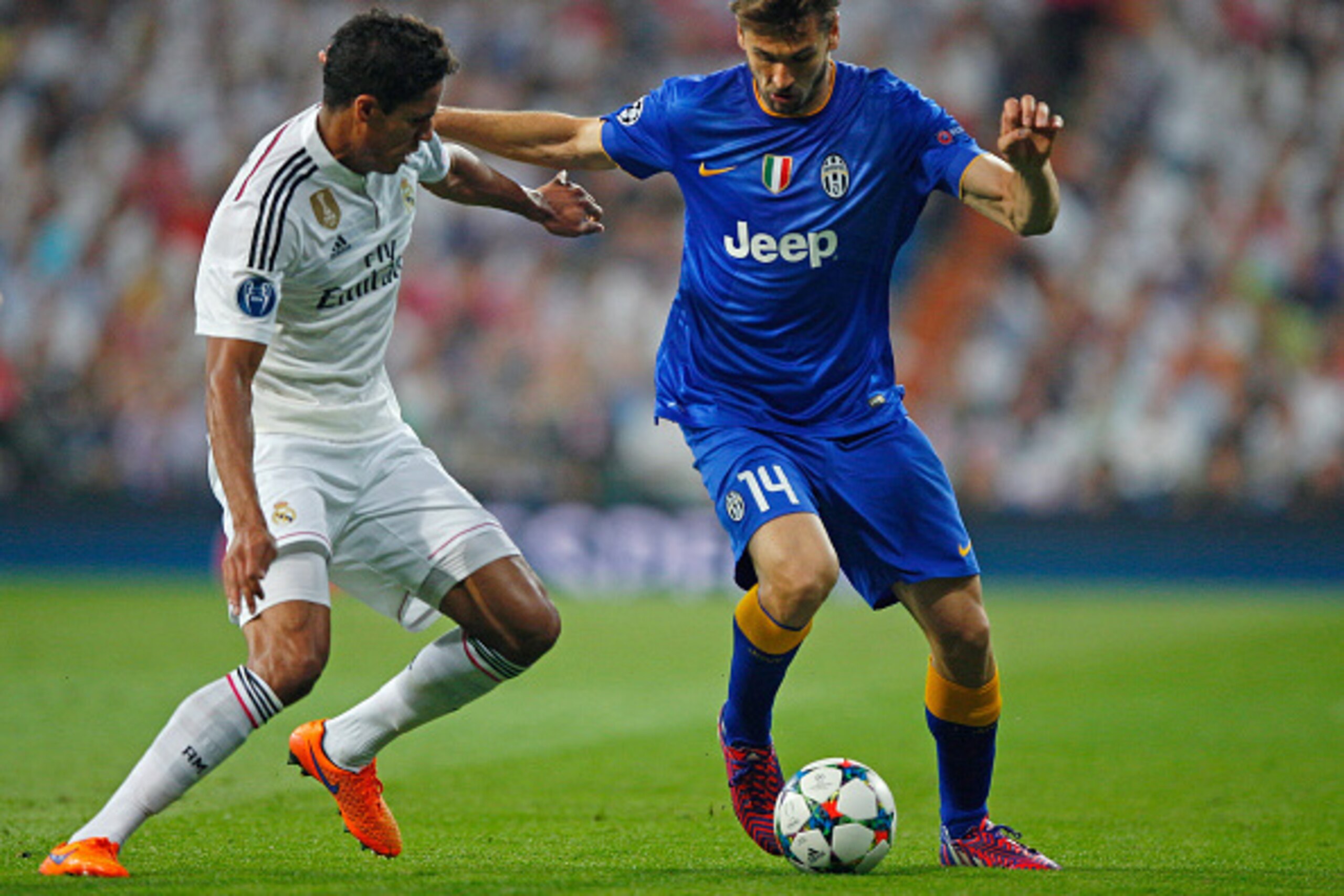 MADRID, SPAIN - MAY 13:  Fernando Llorente of Juventus is challenged by Raphael Varane of Real Madrid during the UEFA Champions League Semi Final, second leg match between Real Madrid and Juventus at Estadio Santiago Bernabeu on May 13, 2015 in Madrid, Sp