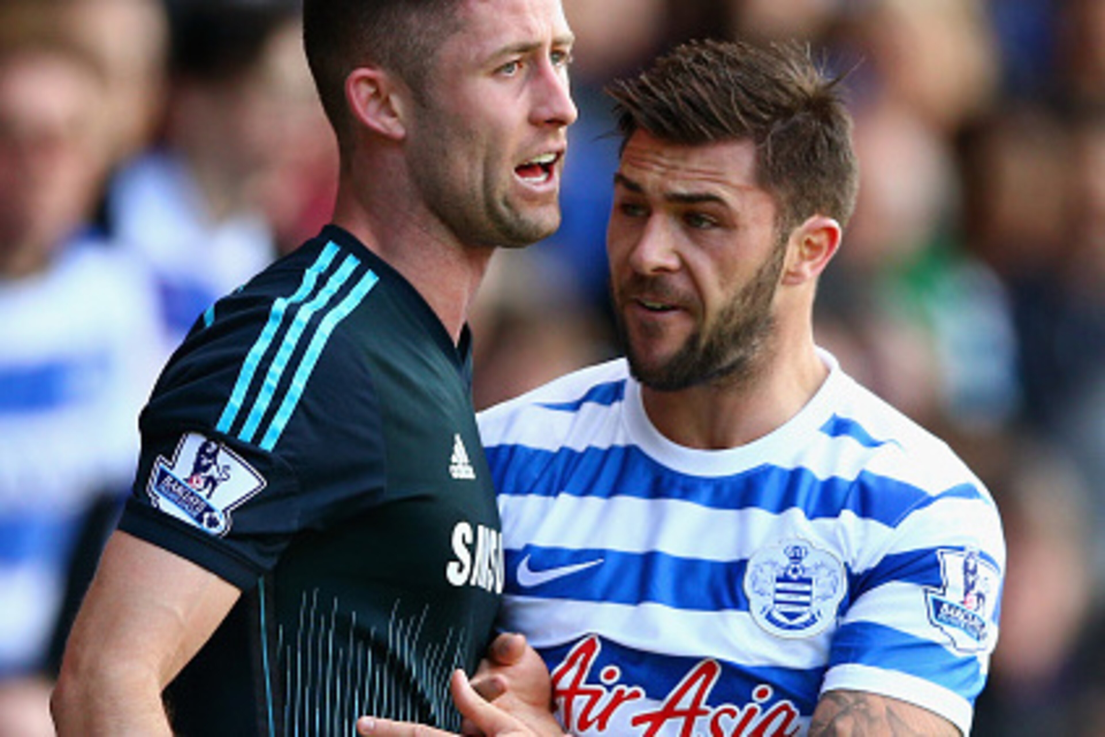 LONDON, ENGLAND - APRIL 12:  Charlie Austin of QPR tries to retrieve the ball from Gary Cahill of Chelsea during the Barclays Premier League match between Queens Park Rangers and Chelsea at Loftus Road on April 12, 2015 in London, England.  (Photo by Paul