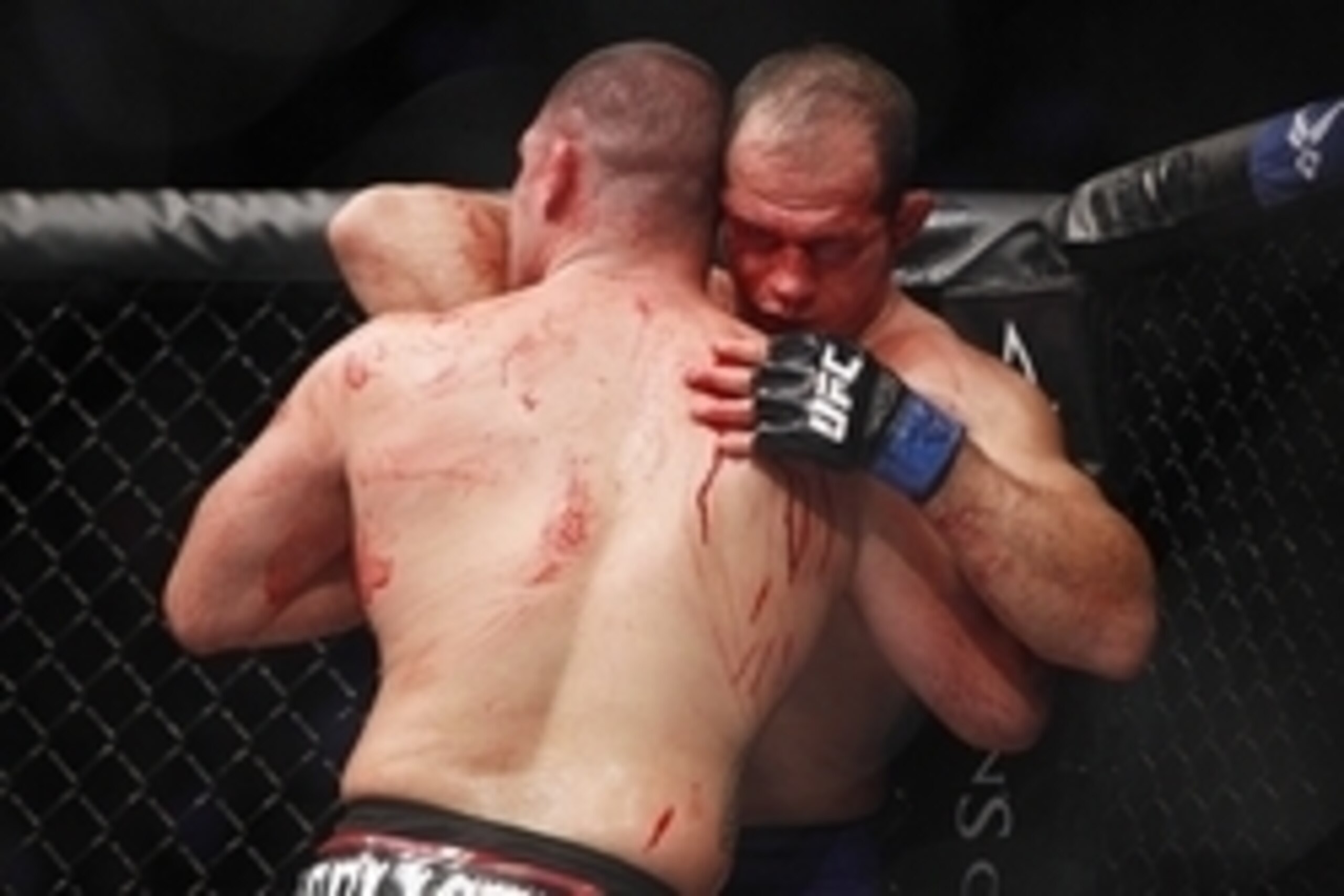 Oct 19, 2013; Houston, TX, USA; Cain Velasquez (red gloves) fights against Junior Dos Santos (blue gloves) in the world heavyweight championship bout during UFC 166 at Toyota Center. Mandatory Credit: Andrew Richardson-USA TODAY Sports