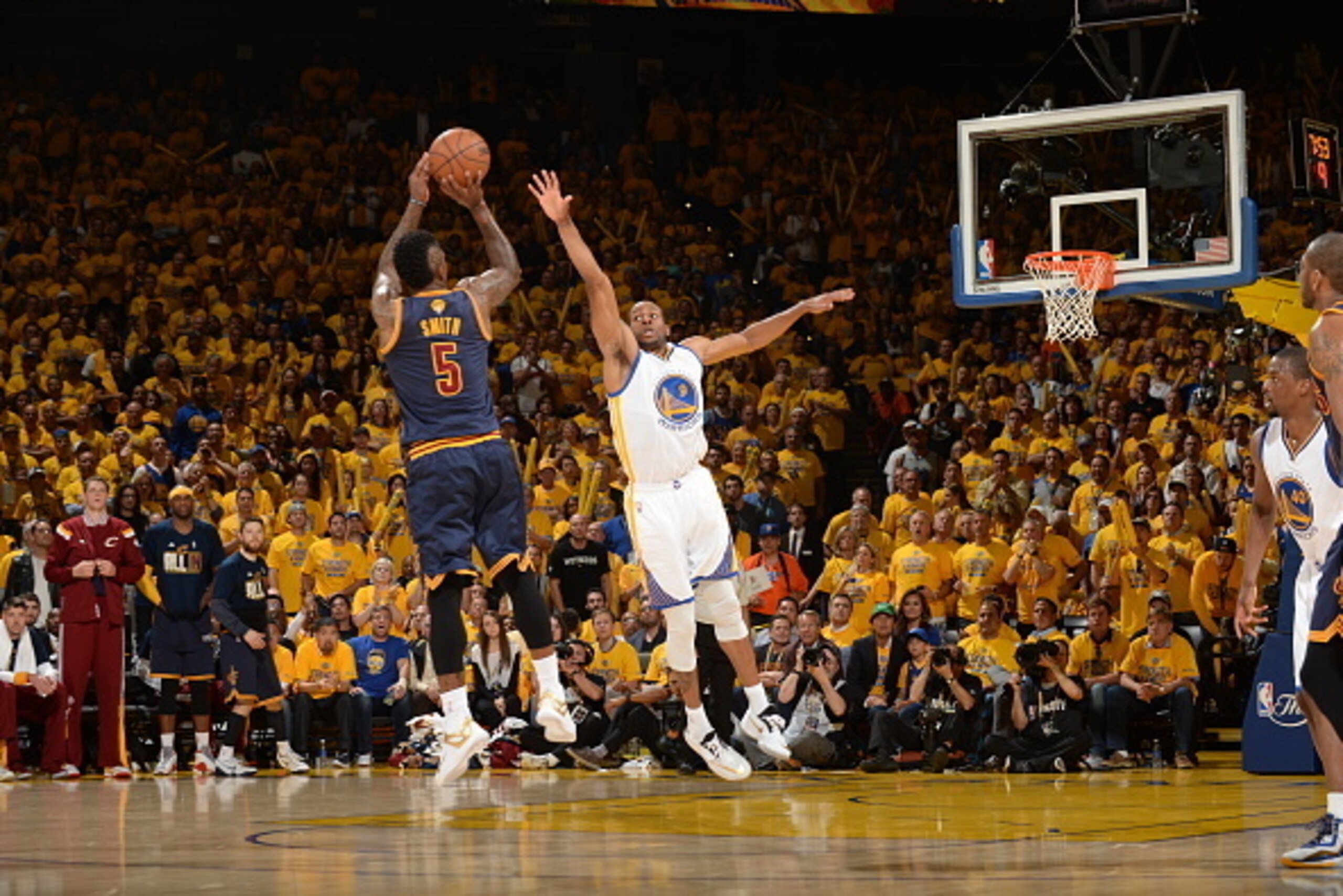 OAKLAND, CA - JUNE 4: J.R. Smith #5 of the Cleveland Cavaliers takes a shot against Andre Iguodala #9 of the Golden State Warriors in Game One of the 2015 NBA Finals on June 4, 2015 at Oracle Arena in Oakland, California. NOTE TO USER: User expressly ackn