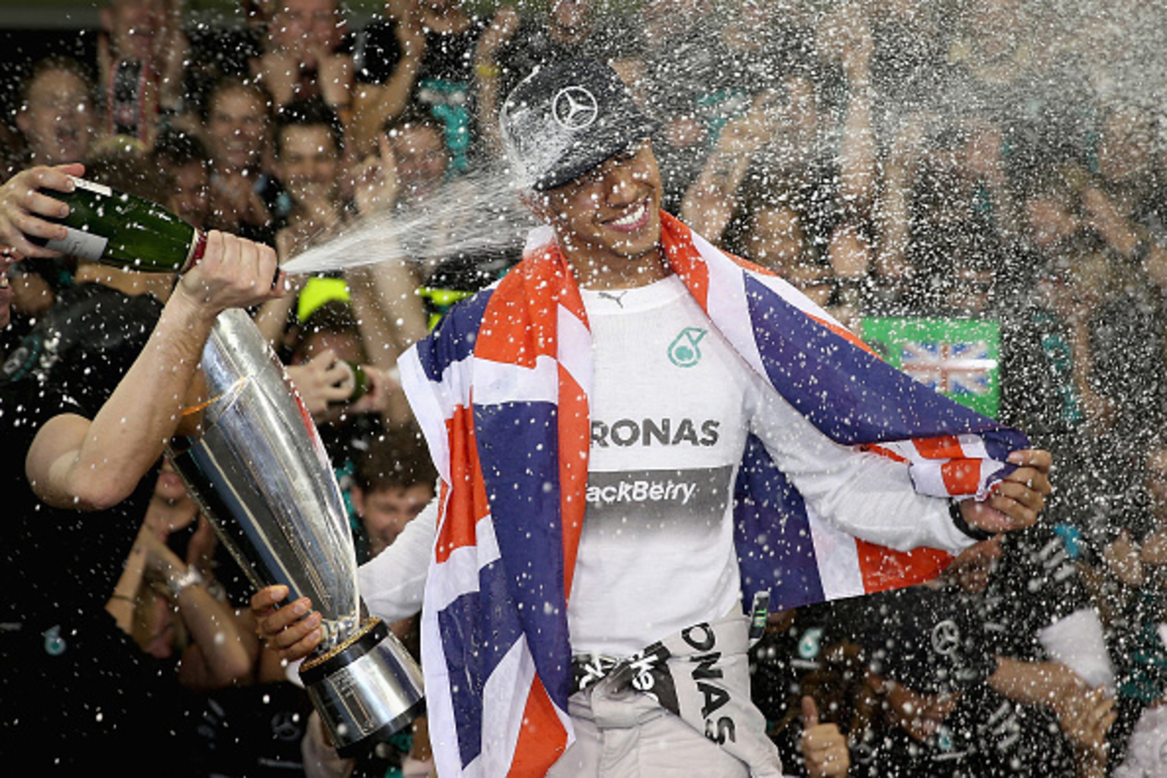 ABU DHABI, UNITED ARAB EMIRATES - NOVEMBER 23: Lewis Hamilton of Great Britain and Mercedes GP celebrates with his team after winning the World Championship after the Abu Dhabi Formula One Grand Prix at Yas Marina Circuit on November 23, 2014 in Abu Dhab ABU DHABI, UNITED ARAB EMIRATES - NOVEMBER 23: Lewis Hamilton of Great Britain and Mercedes GP celebrates with his team after winning the World Championship after the Abu Dhabi Formula One Grand Prix at Yas Marina Circuit on November 23, 2014 in Abu Dhab