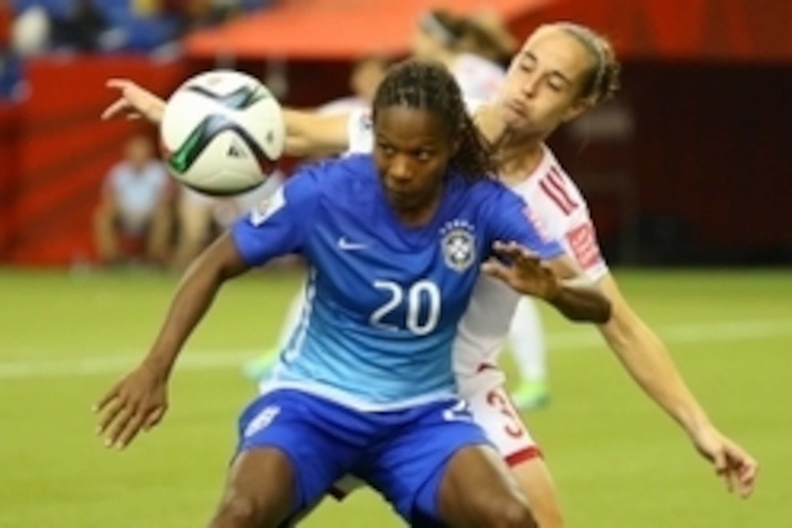 Jun 13, 2015; Montreal, Quebec, CAN; Brazil midfielder Formiga (20) battles Spain defender Leire Landa (3) for control of the ball in the second half of a Group E soccer match in the 2015 FIFA women's World Cup at Olympic Stadium. Mandatory Credit: Jean-Y