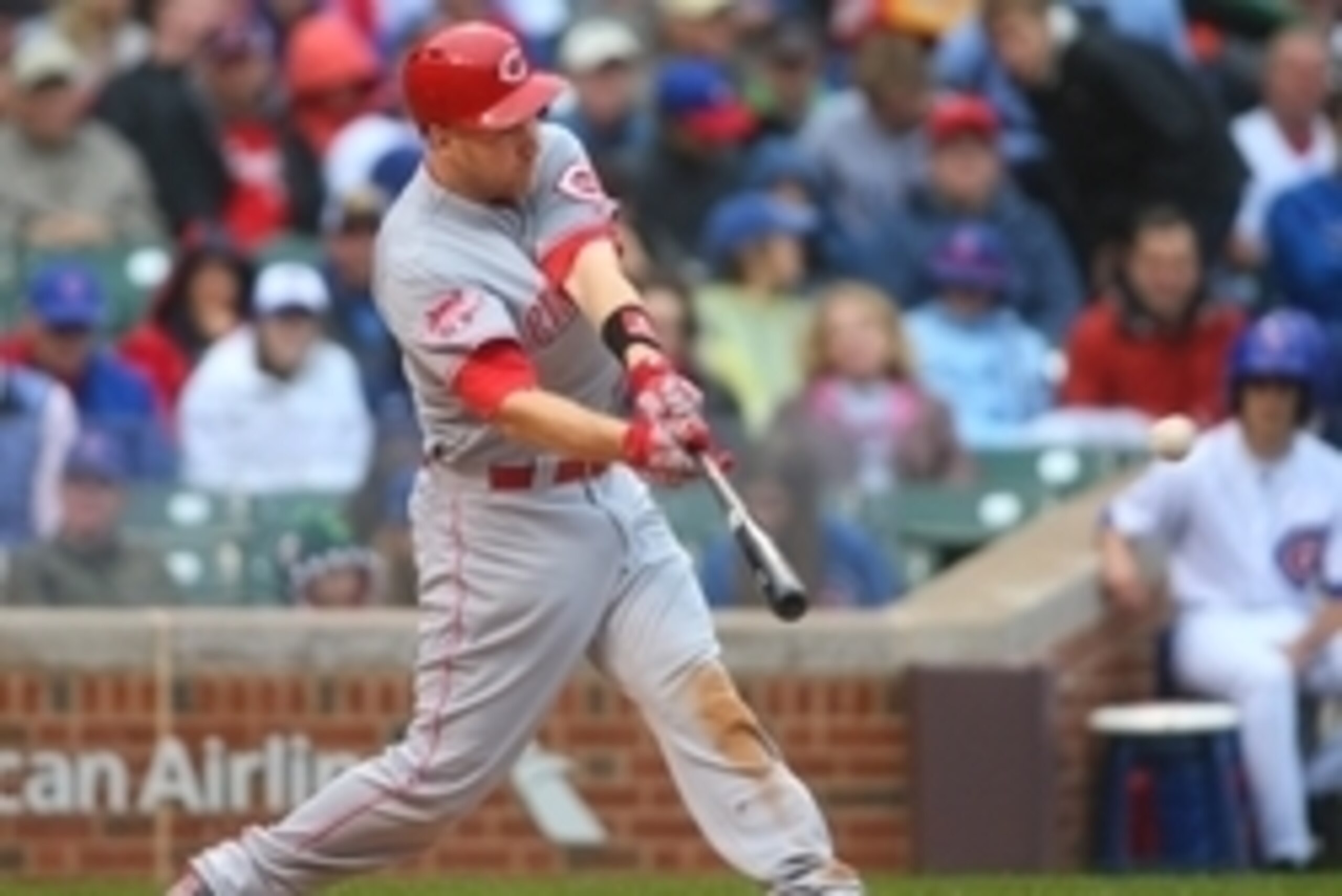 Jun 12, 2015; Chicago, IL, USA; Cincinnati Reds third baseman Todd Frazier (21) hits a home run during the third inning against the Chicago Cubs at Wrigley Field. Mandatory Credit: Caylor Arnold-USA TODAY Sports
