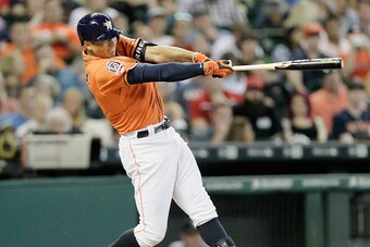 HOUSTON, TX - JUNE 12:  Carlos Correa #1 of the Houston Astros hits a home run in the second inning against the Seattle Mariners at Minute Maid Park on June 12, 2015 in Houston, Texas.  (Photo by Bob Levey/Getty Images)