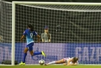 Jun 13, 2015; Montreal, Quebec, CAN; Brazil midfielder Andressa Alves (9) scores a goal as Spain defender Celia Jimenez (2) dives to try to stop the ball in the first half of a Group E soccer match in the 2015 FIFA women's World Cup at Olympic Stadium. Ma