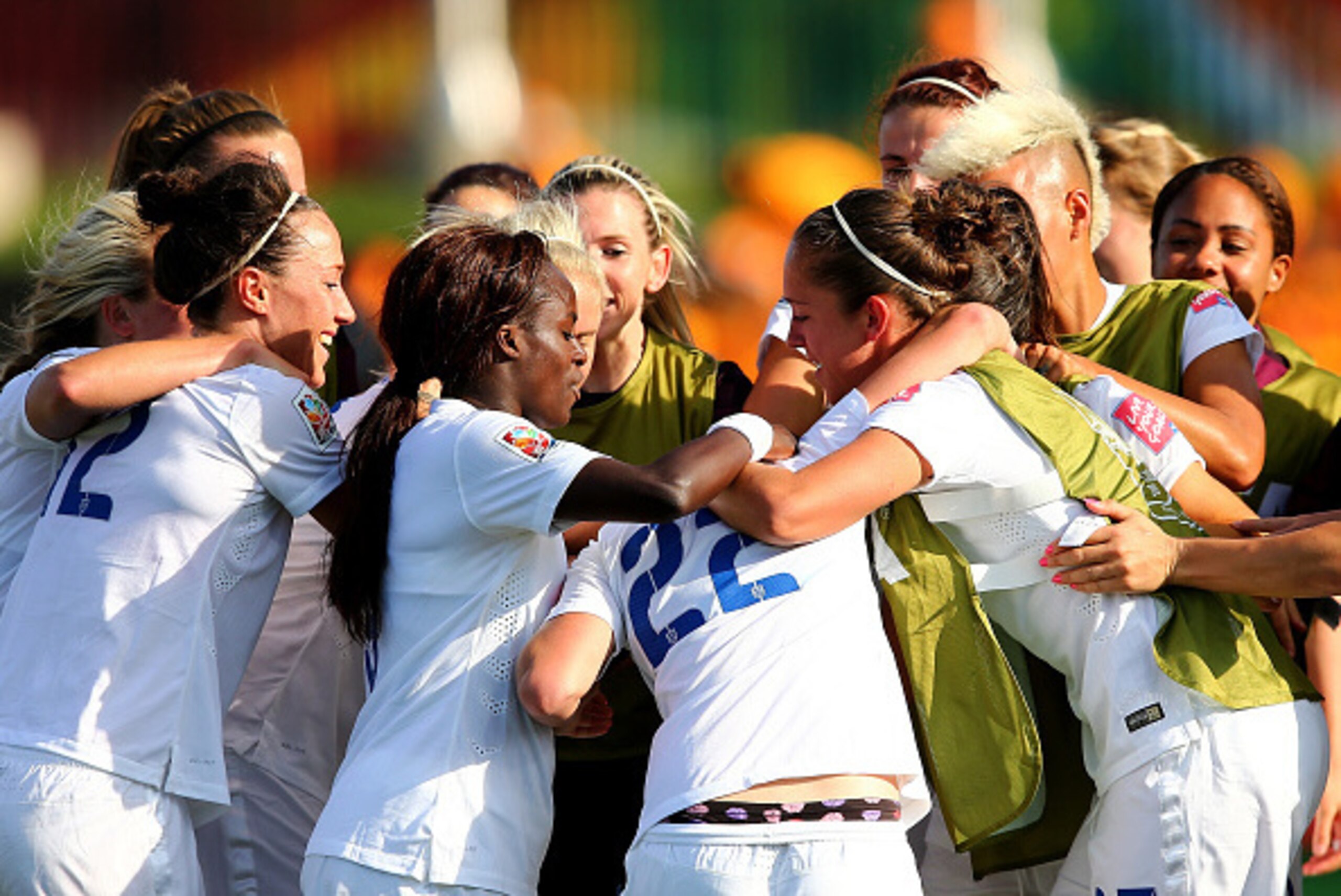 MONCTON, NB - JUNE 13:  Fran Kirby #22 of England is surrounded by her teammates after she scored in the second half against Mexico during the FIFA Women's World Cup 2015 Group F match at Moncton Stadium on June 13, 2015 in Moncton, Canada.  (Photo by Els