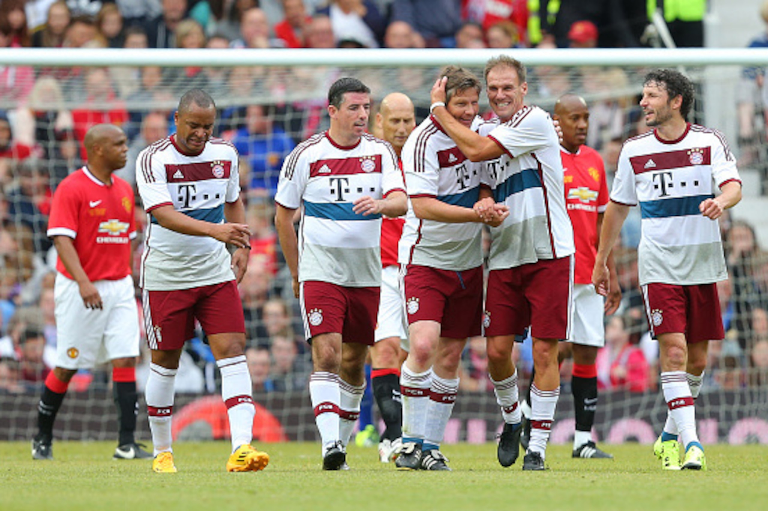 MANCHESTER, ENGLAND - JUNE 14: Michael Tarnat of Bayern Munich All Stars celebrates scoring his sides second goal during the Manchester United Foundation charity match between Manchester United Legends and Bayern Munich All Stars at Old Trafford on June 1