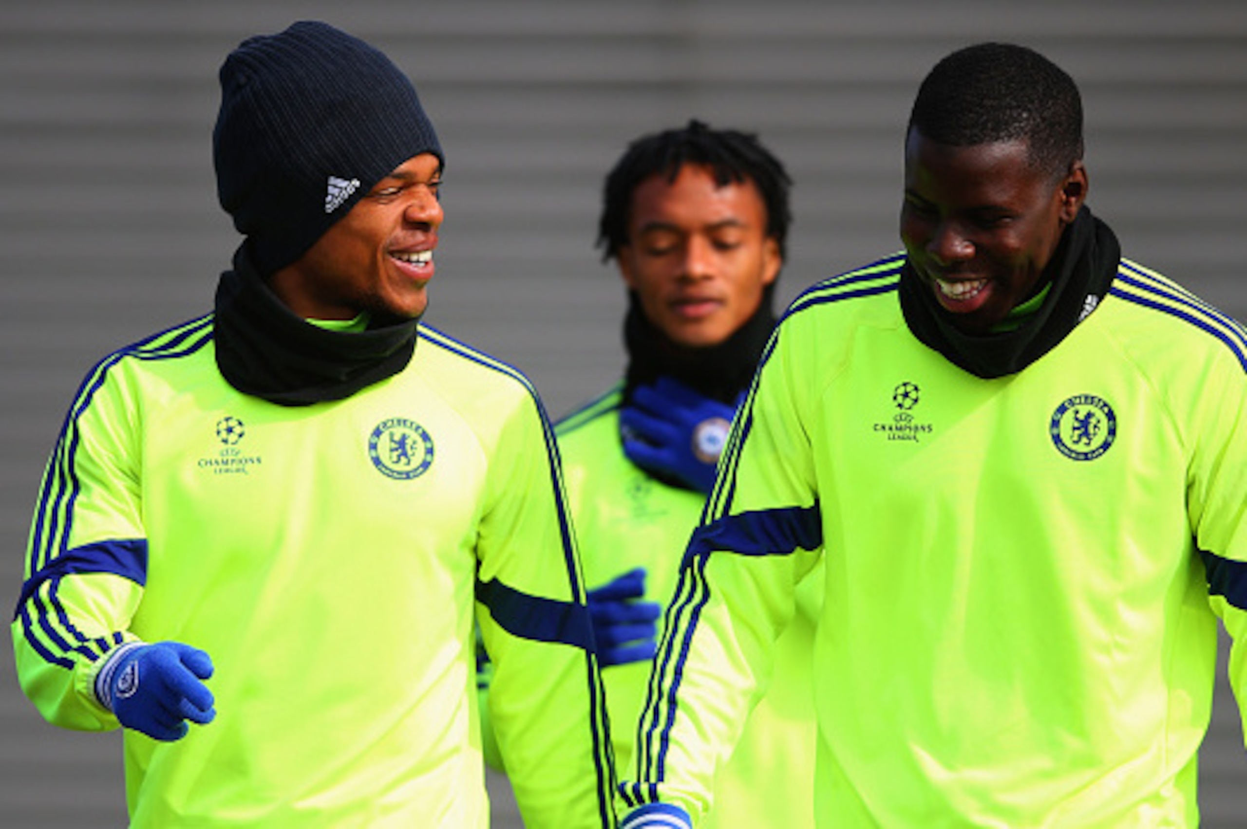 COBHAM, ENGLAND - MARCH 10:  Loic Remy (L) and Kurt Zouma in discussion during a Chelsea training session ahead of the UEFA Champions League Round of 16 second leg match against Paris Saint-Germain at Chelsea Training Ground on March 10, 2015 in Cobham, E