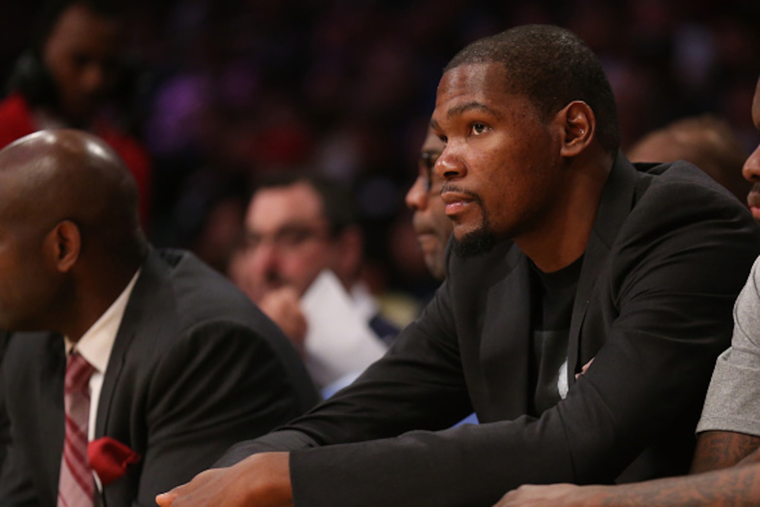 LOS ANGELES, CA - MARCH 01:  Injured player Kevin Durant of the Oklahoma City Thunder looks on from the bench during the game against the Los Angeles Lakers at Staples Center on March 1, 2015 in Los Angeles, California.  The Thunder won 108-101.   NOTE TO