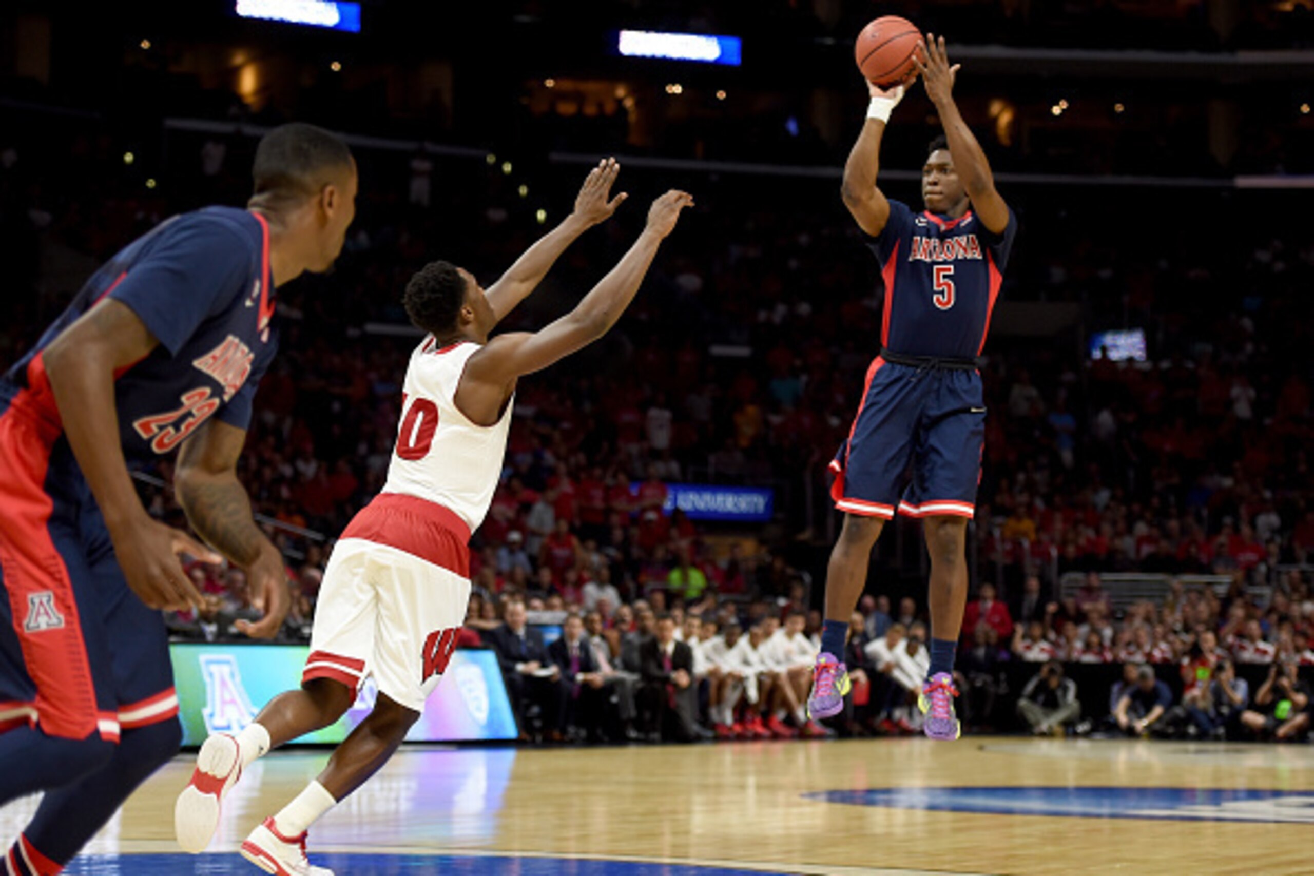 LOS ANGELES, CA - MARCH 28:  Stanley Johnson #5 of the Arizona Wildcats shoots over Nigel Hayes #10 of the Wisconsin Badgers in the first half during the West Regional Final of the 2015 NCAA Men's Basketball Tournament at Staples Center on March 28, 2015 