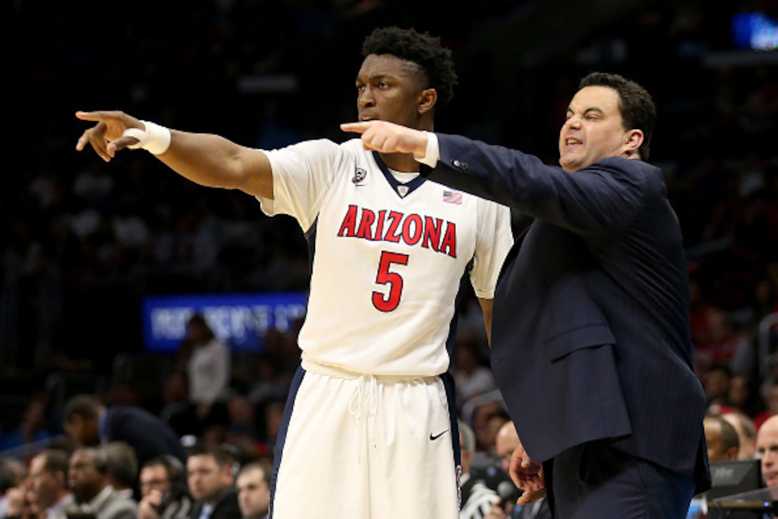 LOS ANGELES, CA - MARCH 26:  Stanley Johnson #5 and head coach Sean Miller of the Arizona Wildcats point in the second half while taking on the Xavier Musketeers during the West Regional Semifinal of the 2015 NCAA Men's Basketball Tournament at Staples Ce