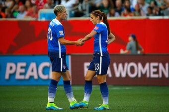 WINNIPEG, MB - JUNE 12:  Abby Wambach #20 shakes hands with Alex Morgan #13 of the United States in the second half against Sweden in the FIFA Women's World Cup Canada 2015 match at Winnipeg Stadium on June 12, 2015 in Winnipeg, Canada.  (Photo by Kevin C