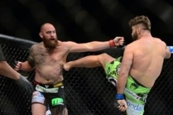 May 23, 2015; Las Vegas, NV, USA; Travis Browne (red gloves) and Andei Arlovski (blue gloves) fight during their heavyweight bout during UFC 187 at MGM Grand Garden Arena. Arlovski won via first round TKO. Mandatory Credit: Joe Camporeale-USA TODAY Sports