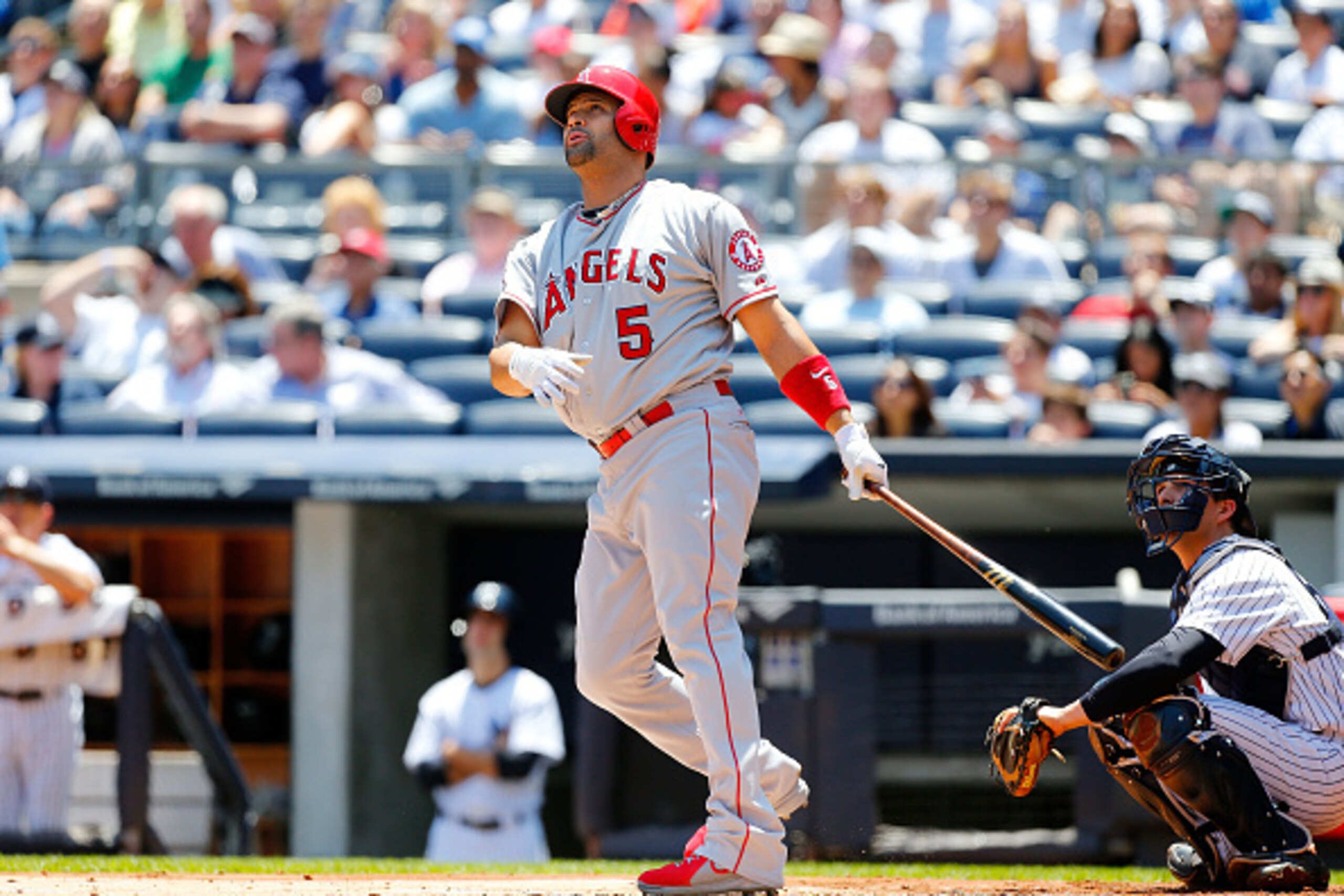NEW YORK, NY - JUNE 07:  Albert Pujols #5 of the Los Angeles Angels of Anaheim follows through on a first inning home run against the New York Yankees at Yankee Stadium on June 7, 2015 in the Bronx borough of New York City.  (Photo by Jim McIsaac/Getty Im