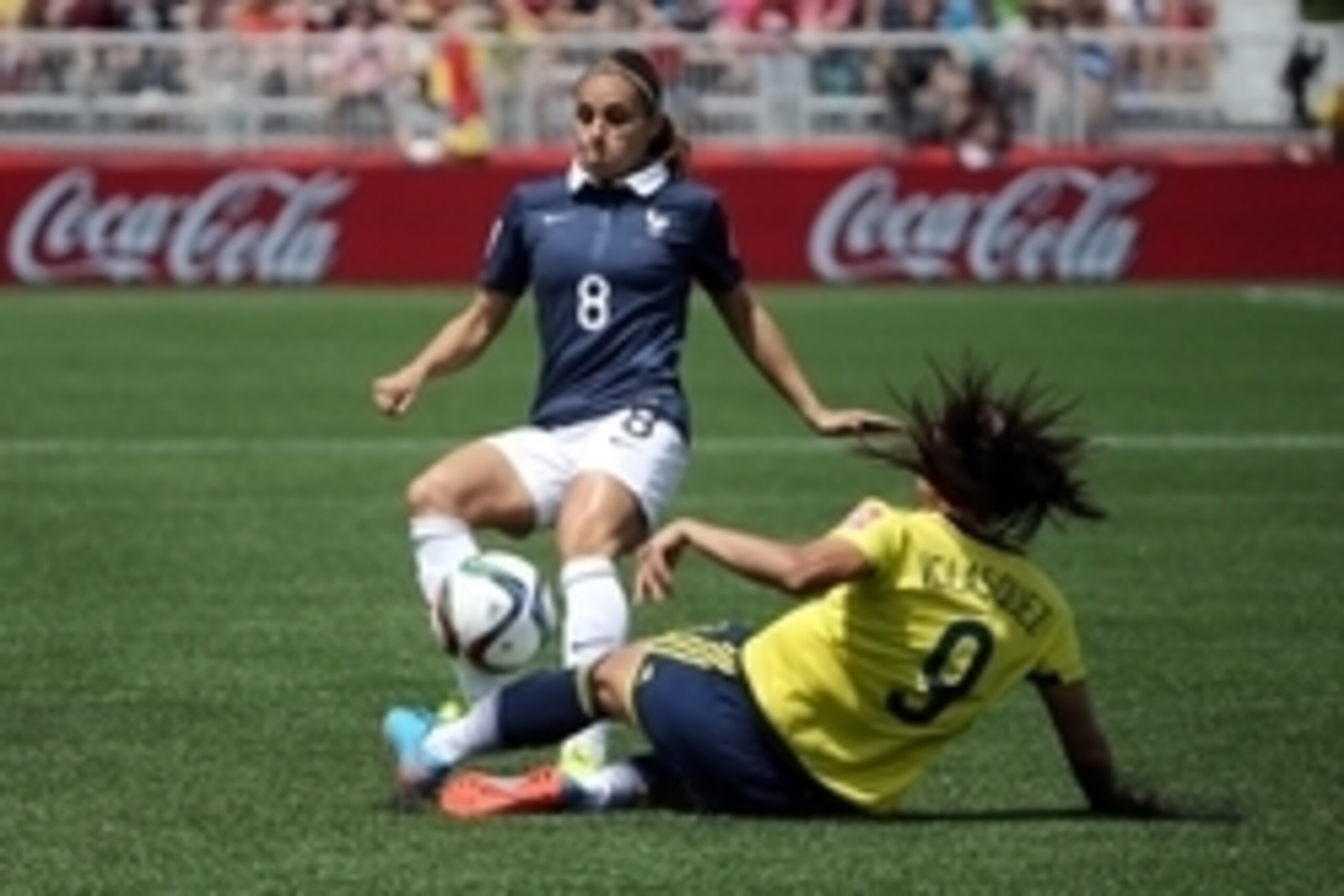 Jun 13, 2015; Moncton, New Brunswick, CAN; France defender Jessica Houara (8) and Colombia midfielder Orianica Velasquez (9) battle for the ball during the first half in a Group F soccer match in the 2015 FIFA women's World Cup at Moncton Stadium. Mandato